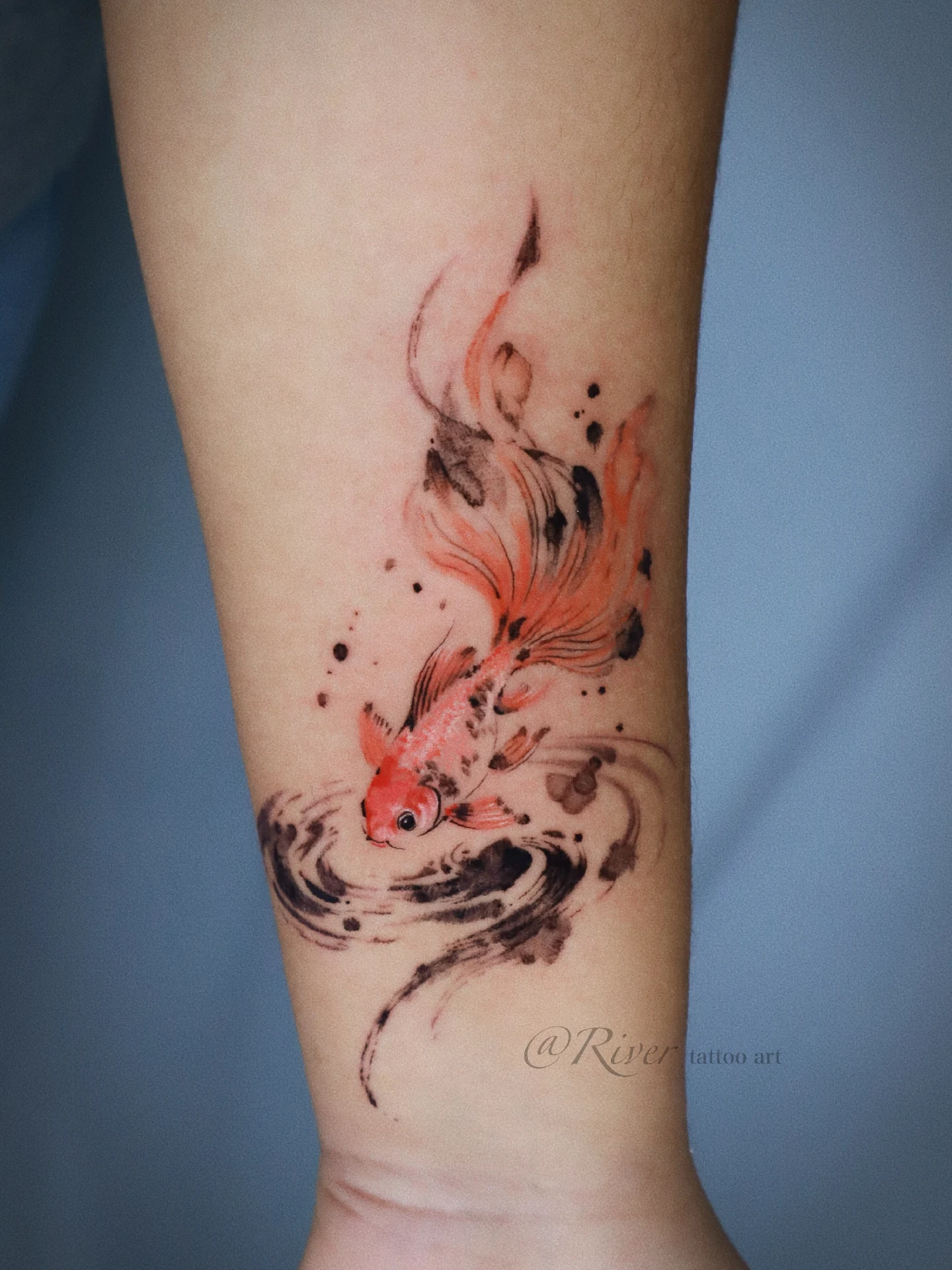 Goldfish dotwork tattoo on the forearm by River