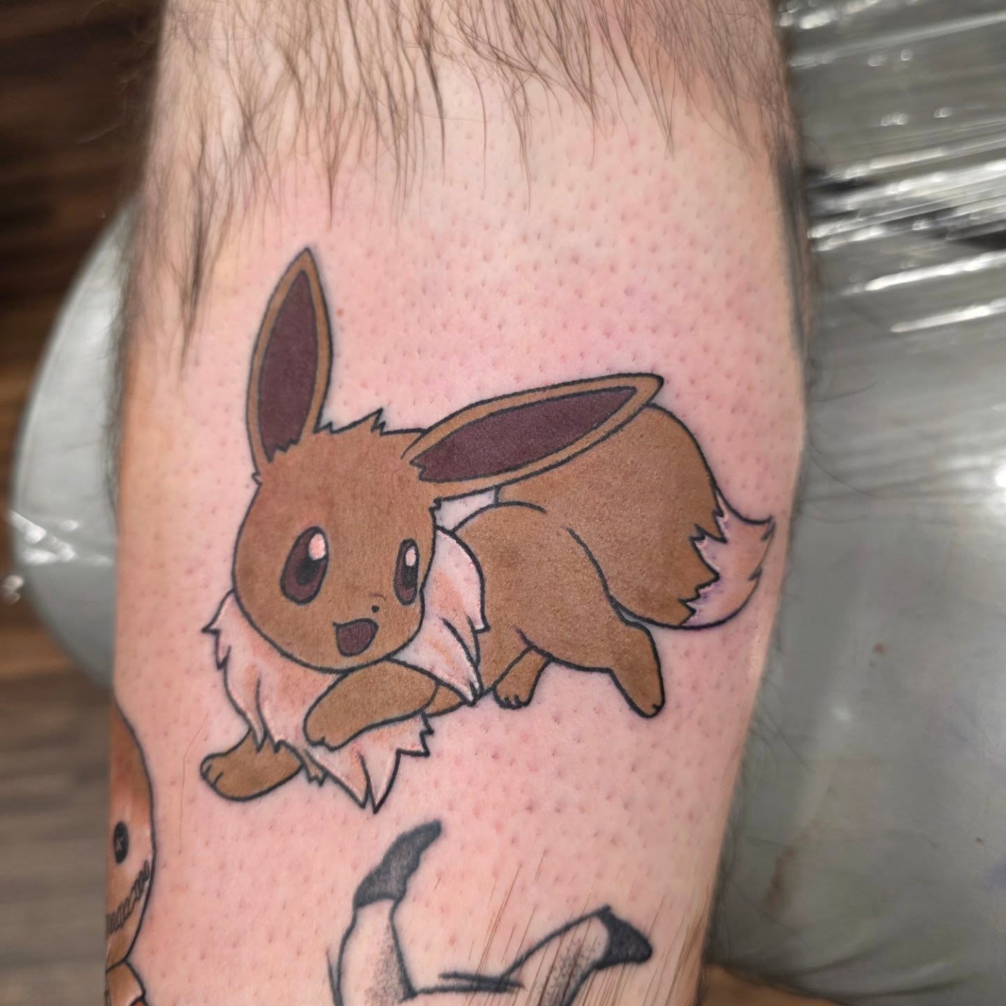 Eevee anime tattoo on the forearm by Mandy Rizzuto