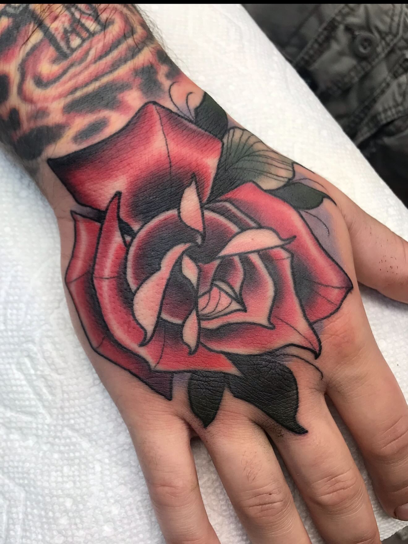 Rose realism tattoo on the hand by Kyle Behr
