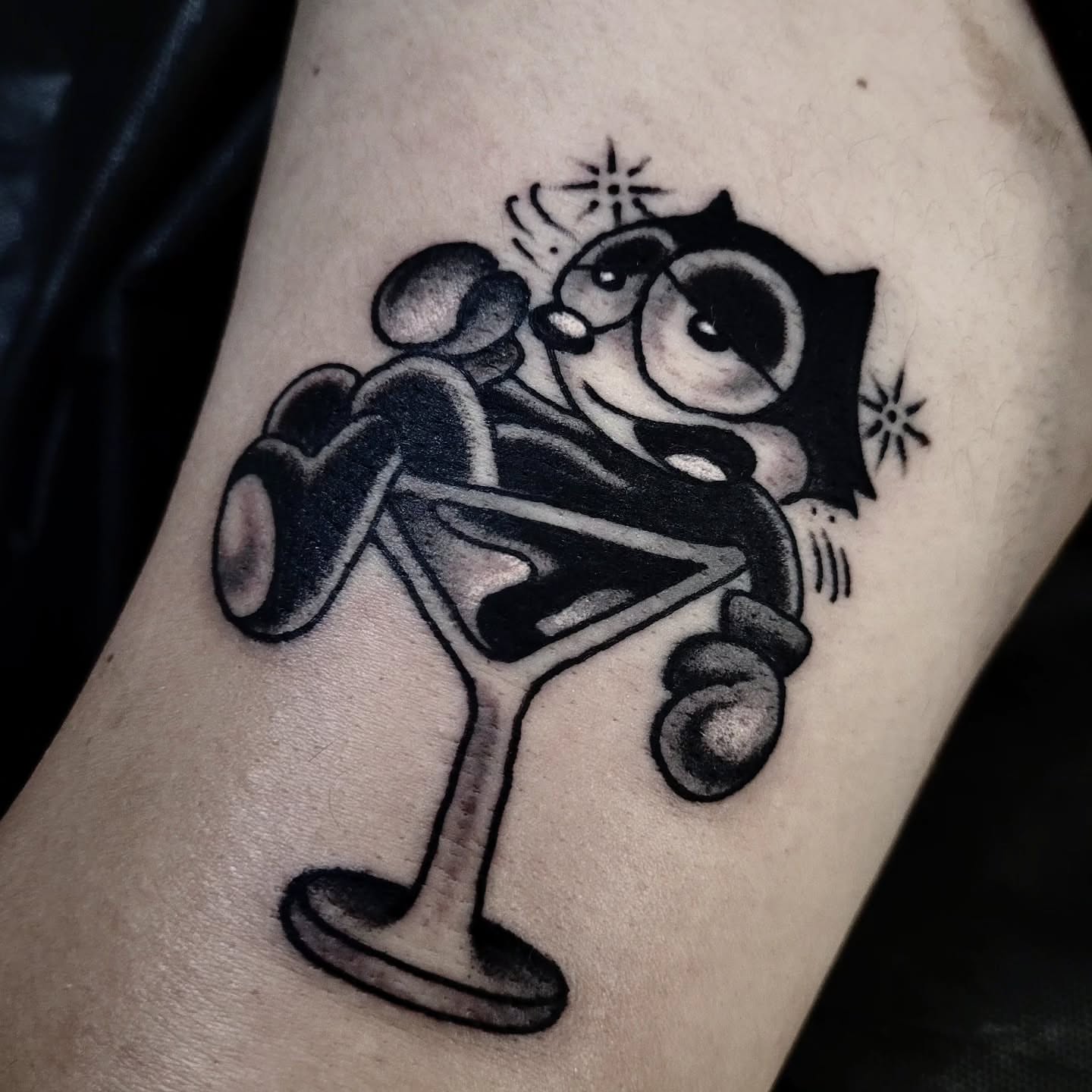 Owl with cocktail glass black and grey tattoo on the forearm by S. Madrid