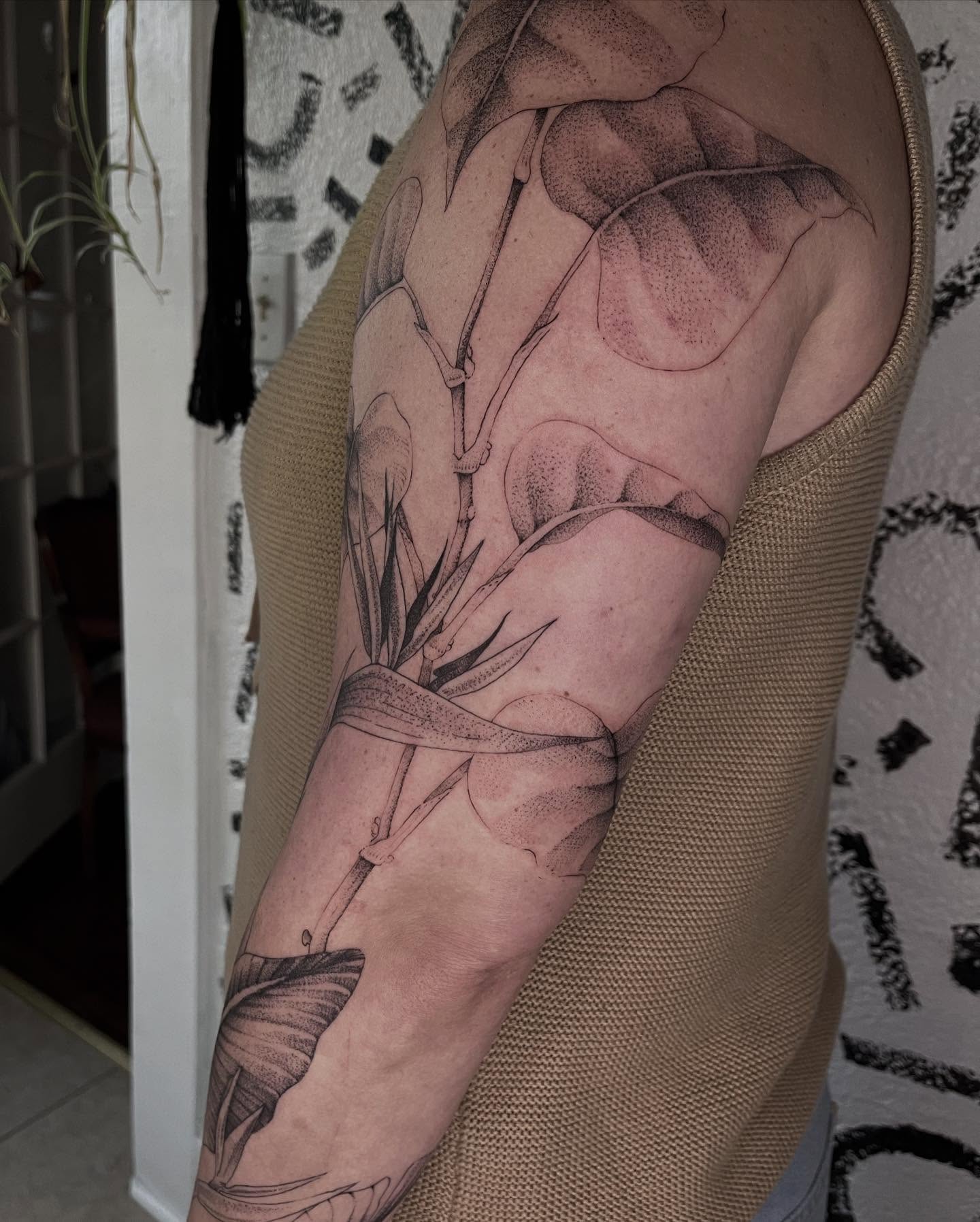 Calla lily dotwork tattoo on the forearm by Victoria Irula