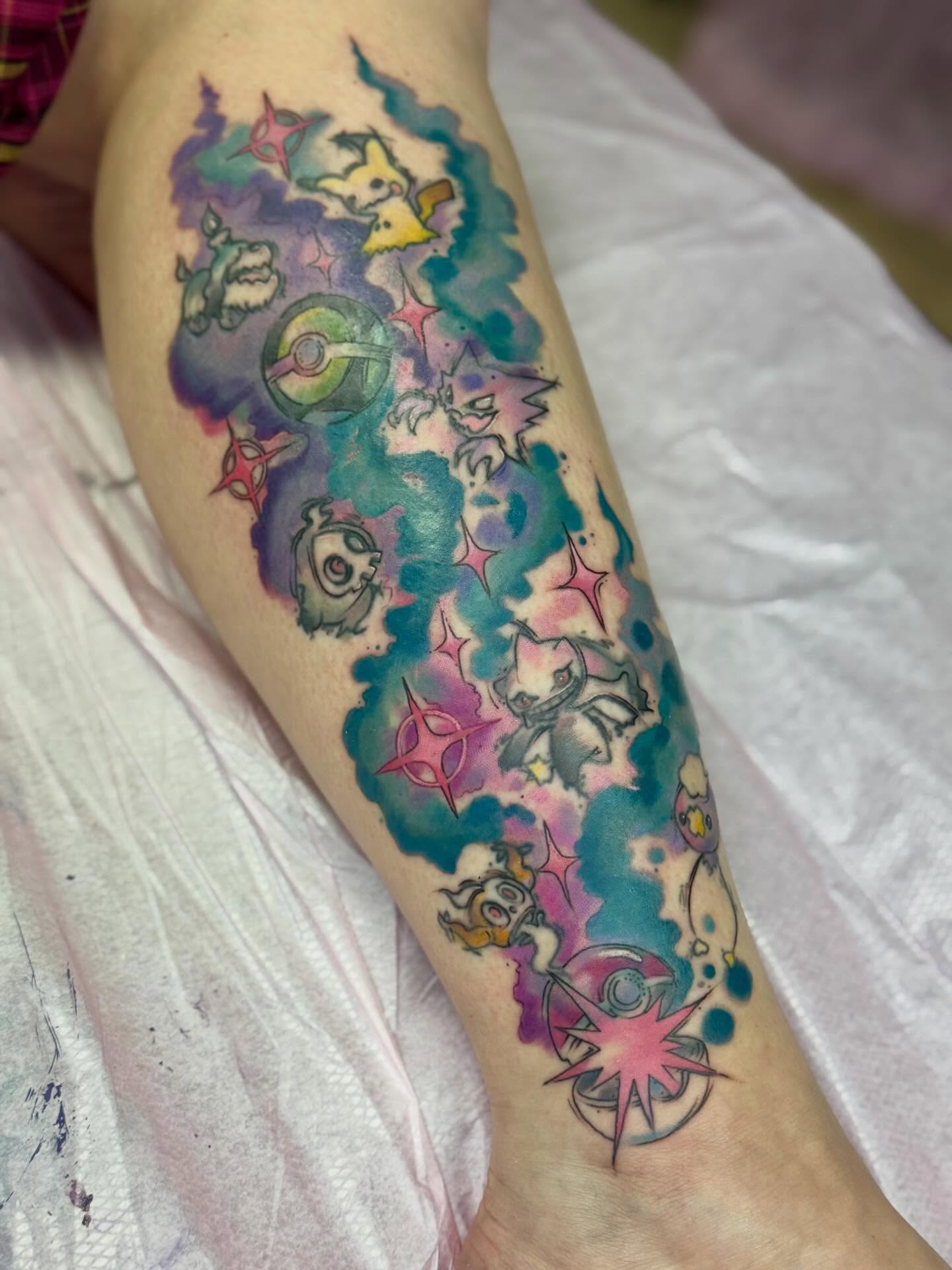 Pokémon characters watercolor tattoo on the forearm by Eileen Joyce