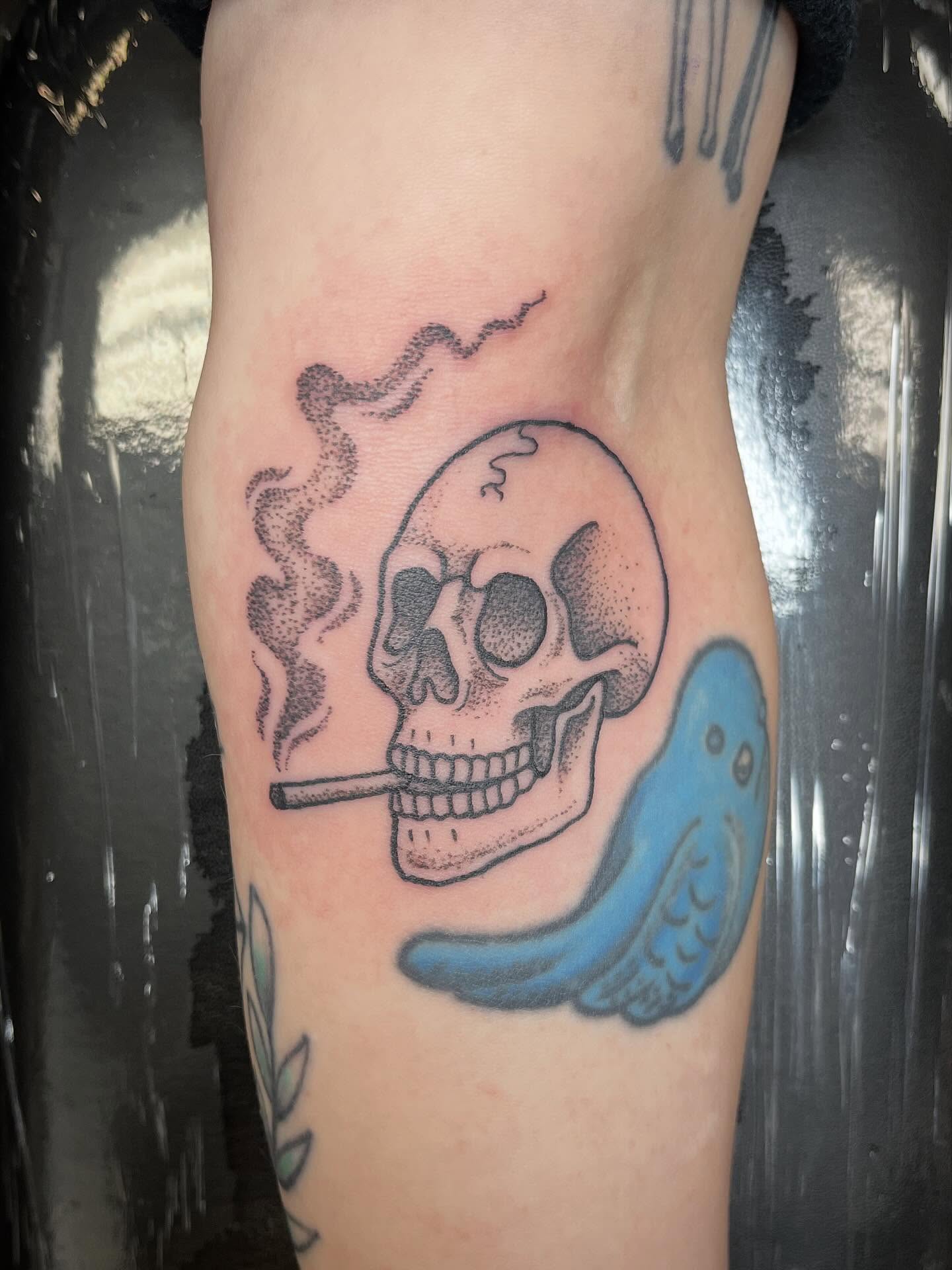 Smoking skull with bird dotwork tattoo on the forearm by Hit & Run Tattoo, Dayton, Ohio