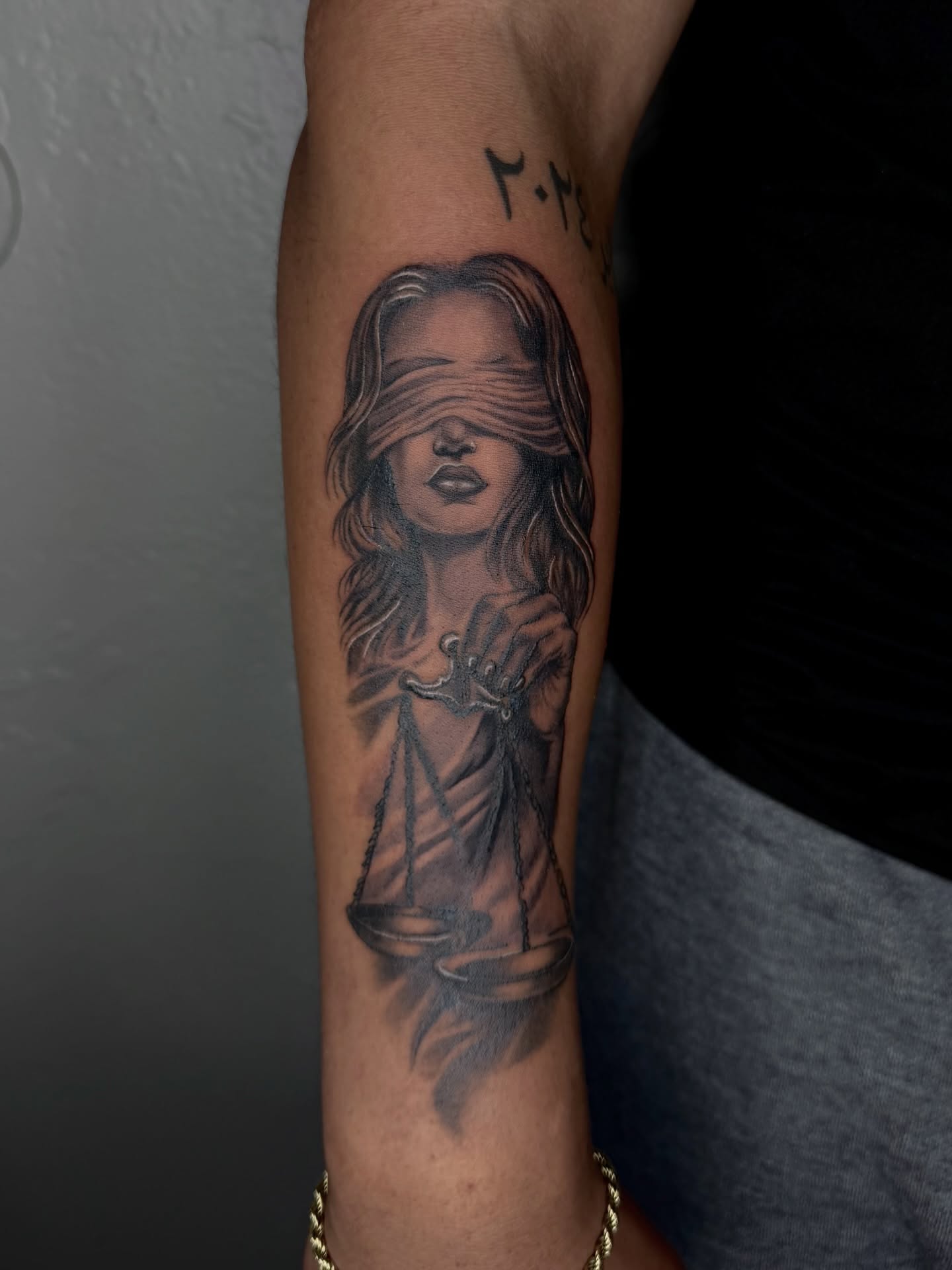 Lady Justice realism tattoo on the forearm by jayla pantig
