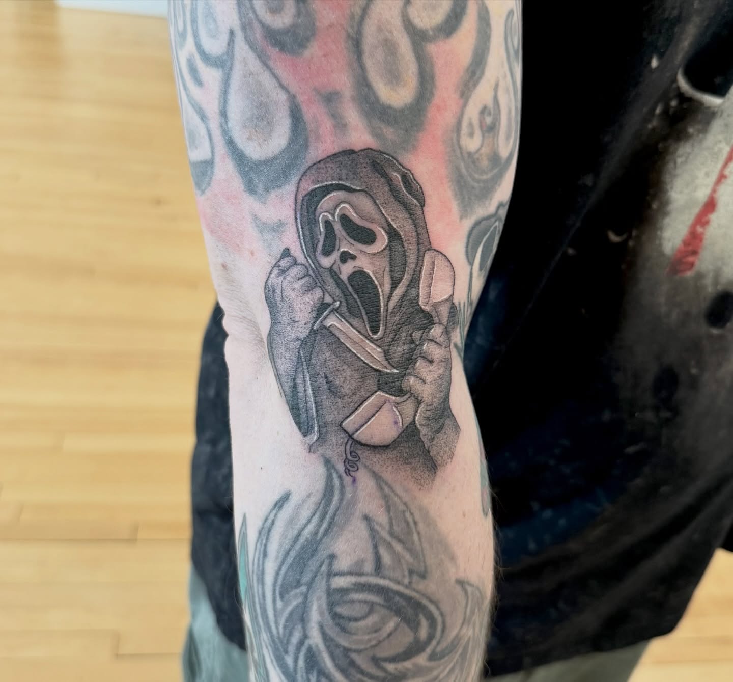Ghost mask black and grey tattoo on the forearm by Kelsey Lynn▪️Raleigh Tattoo Artist