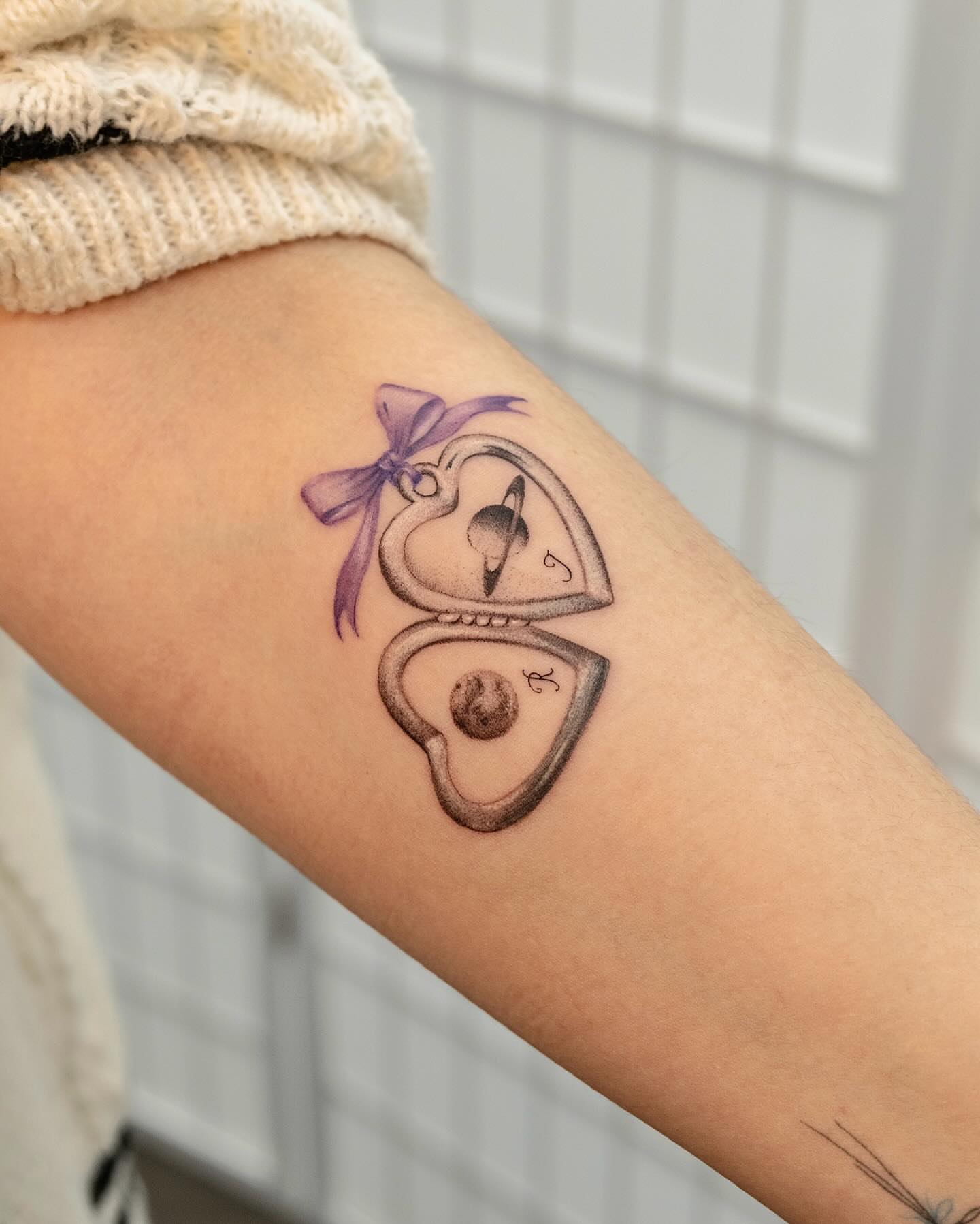 Heart lock black and grey tattoo on the forearm by Koko