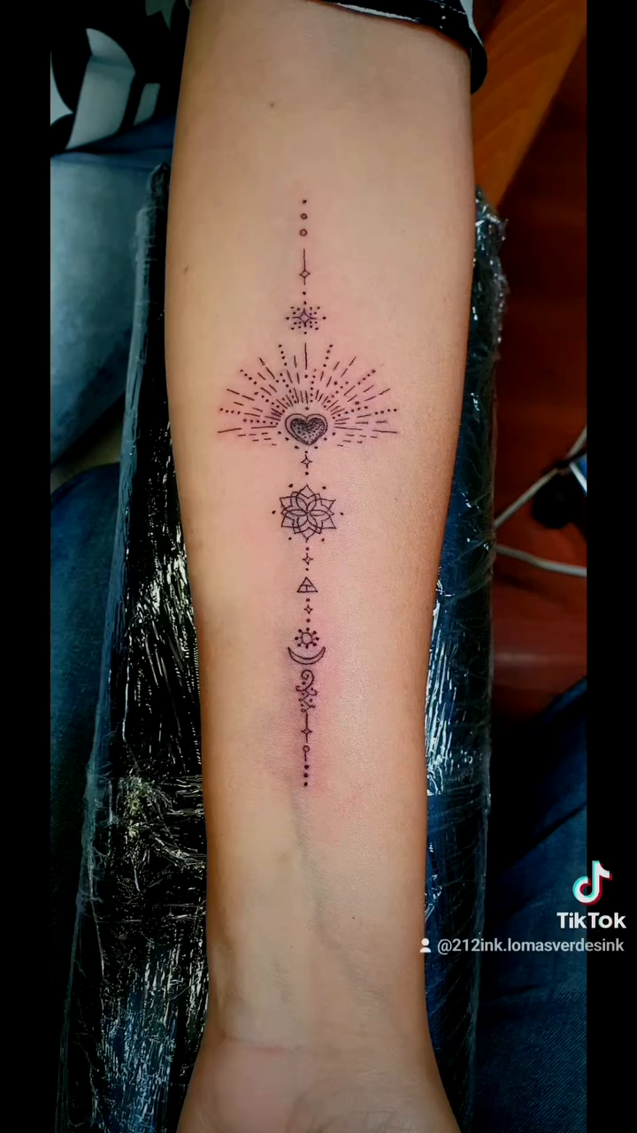 Eye and geometric symbols ornamental tattoo on the forearm by Tatuajes Betto Ink Tattoo