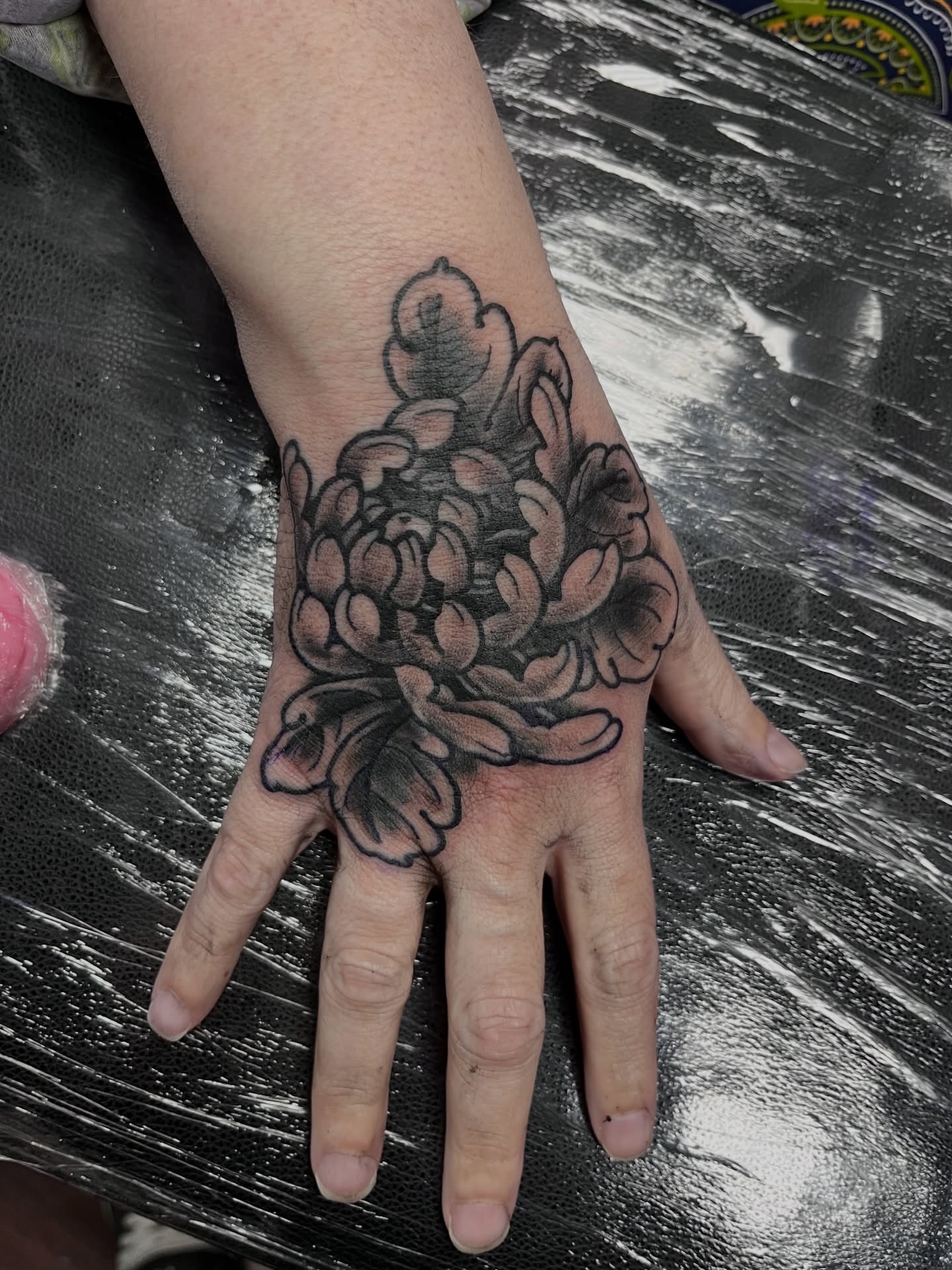 Flower black and grey tattoo on the hand by You’ll save me in your phone as Tattoo Tim