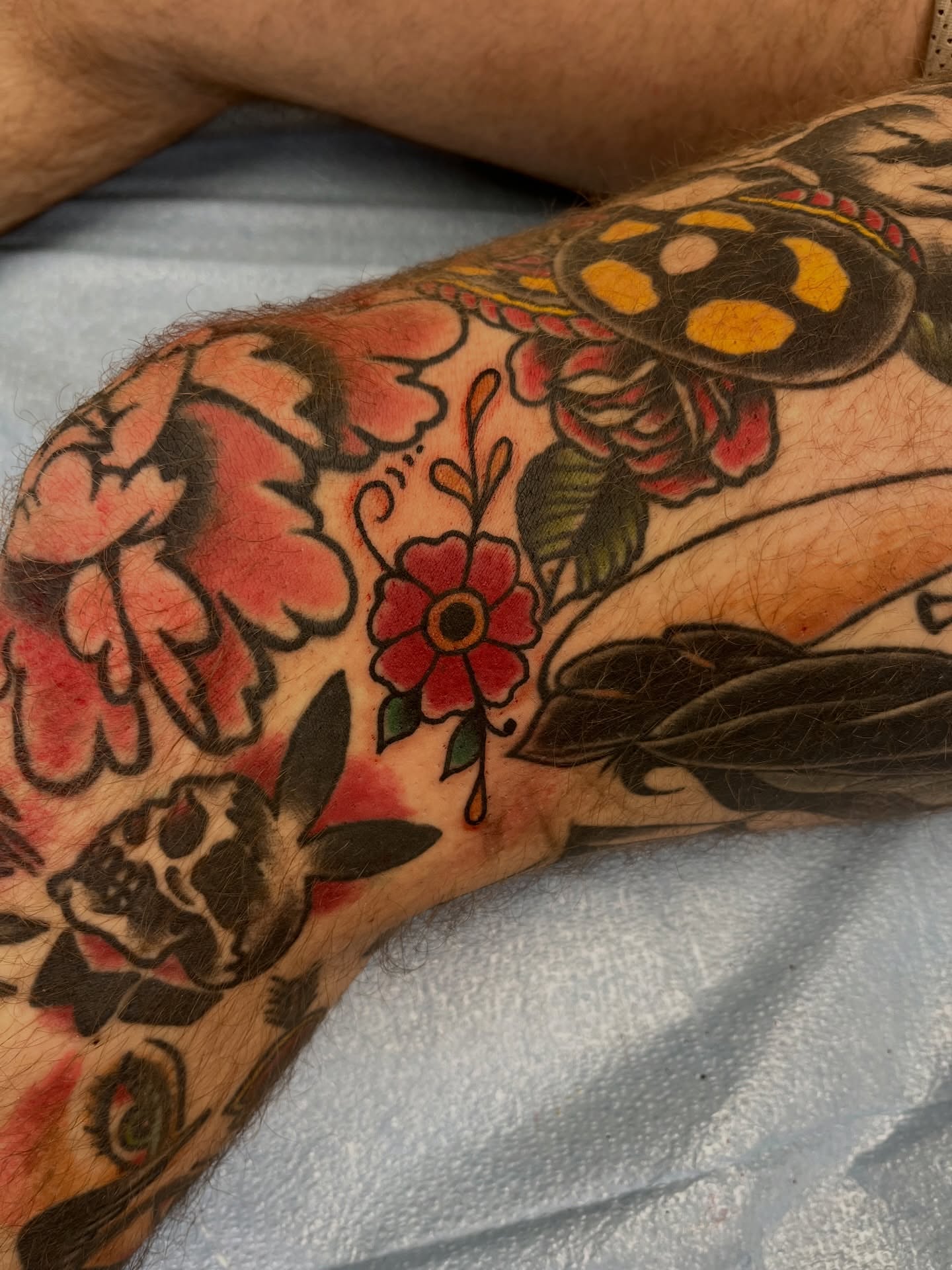 Floral and butterfly American traditional tattoo on the forearm by You’ll save me in your phone as Tattoo Tim