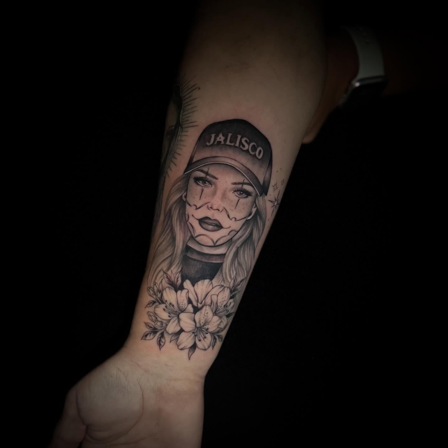 Woman wearing cap realism tattoo on the forearm by Sad Girl Tattoos