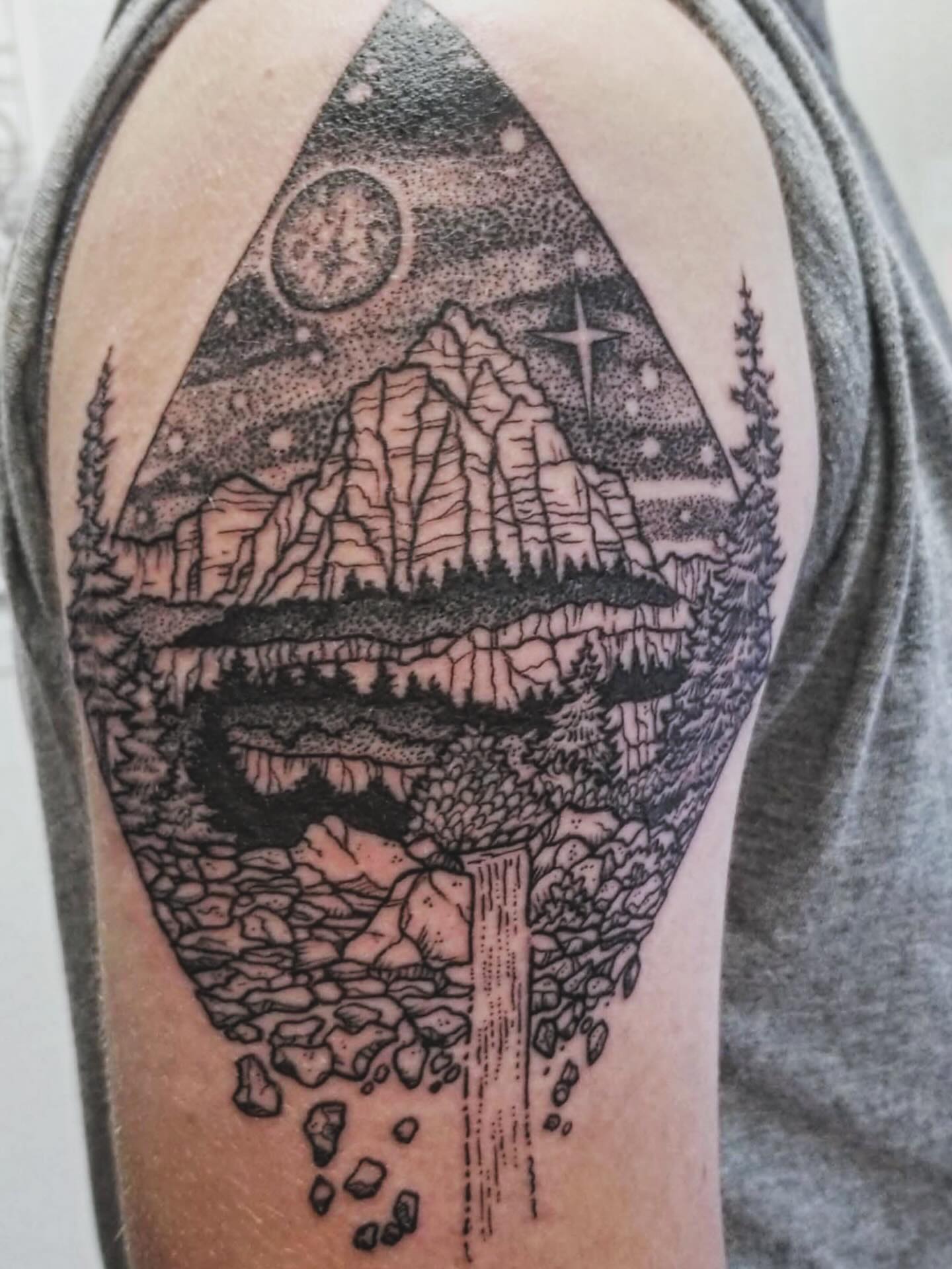 Mountain landscape dotwork tattoo on the forearm by Jason Middelton