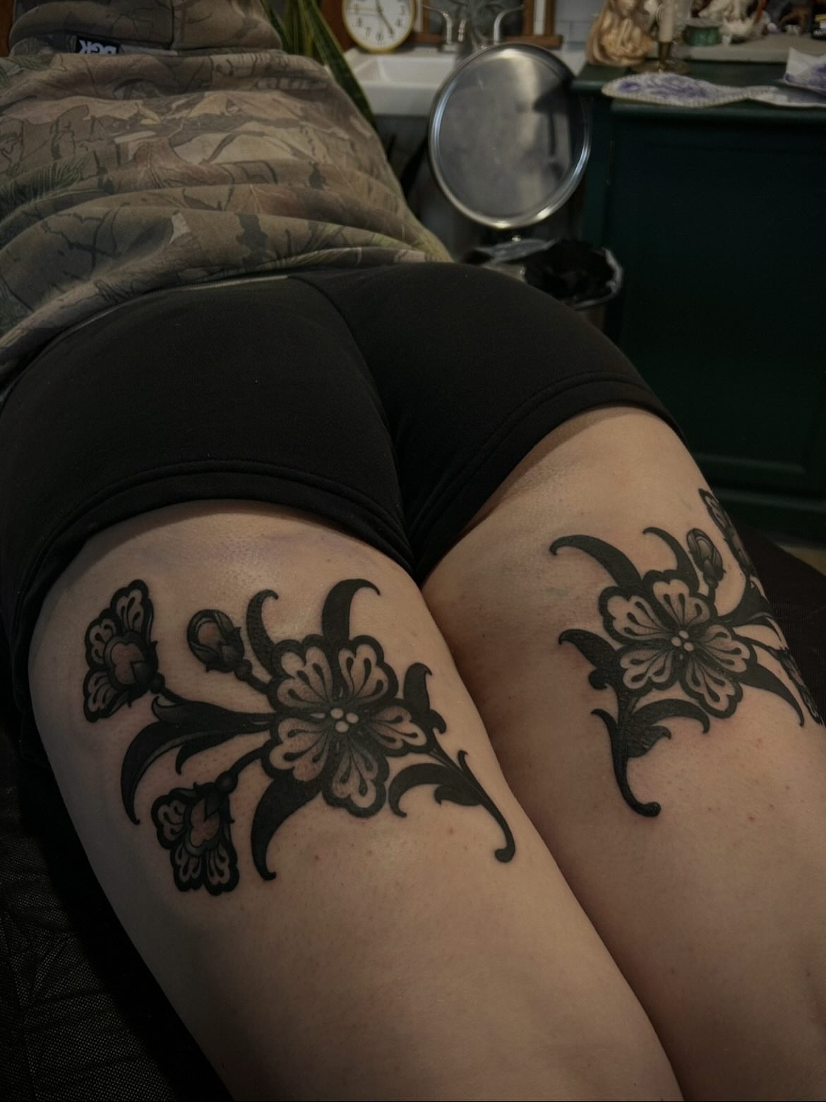 Floral black and grey tattoo on the thigh by ꧁𝙺𝚊𝚛𝚒𝚗𝚊꧂, Grinnell, Iowa