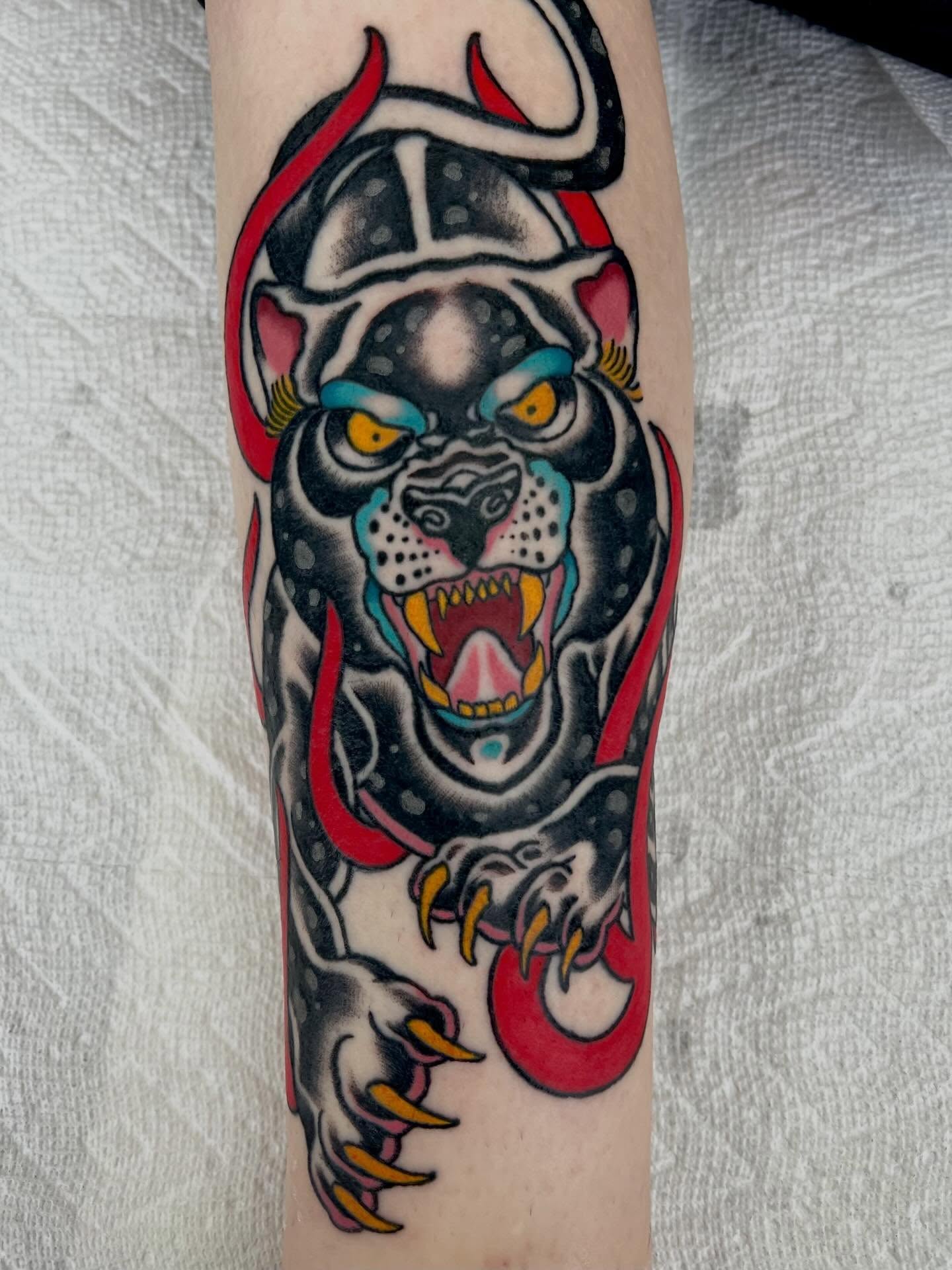 Panther warrior American traditional tattoo on the forearm by Brandon McDaniel Iowa Tattoo Artist