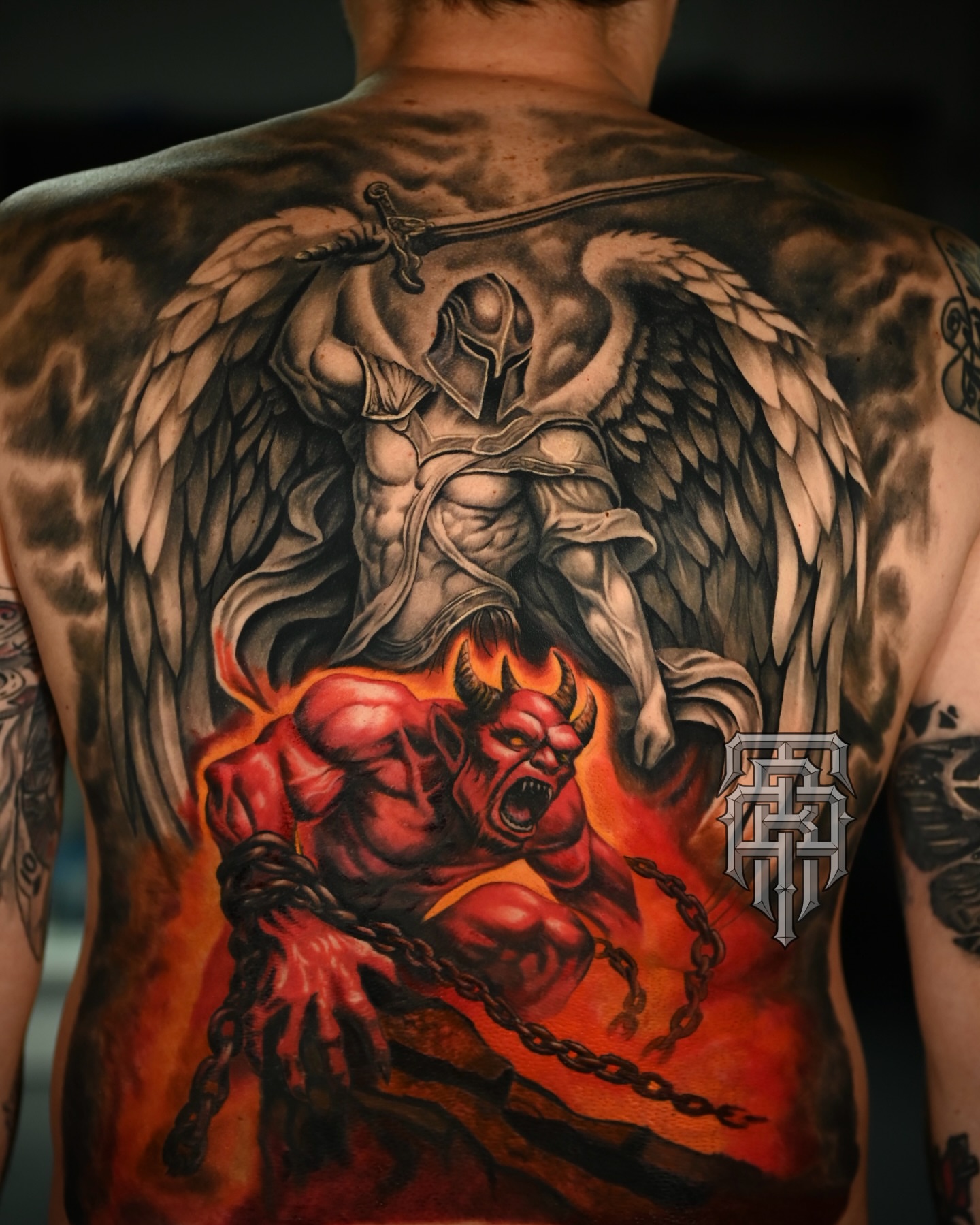 Demon and angel dark realism tattoo on the back by Art Lopez