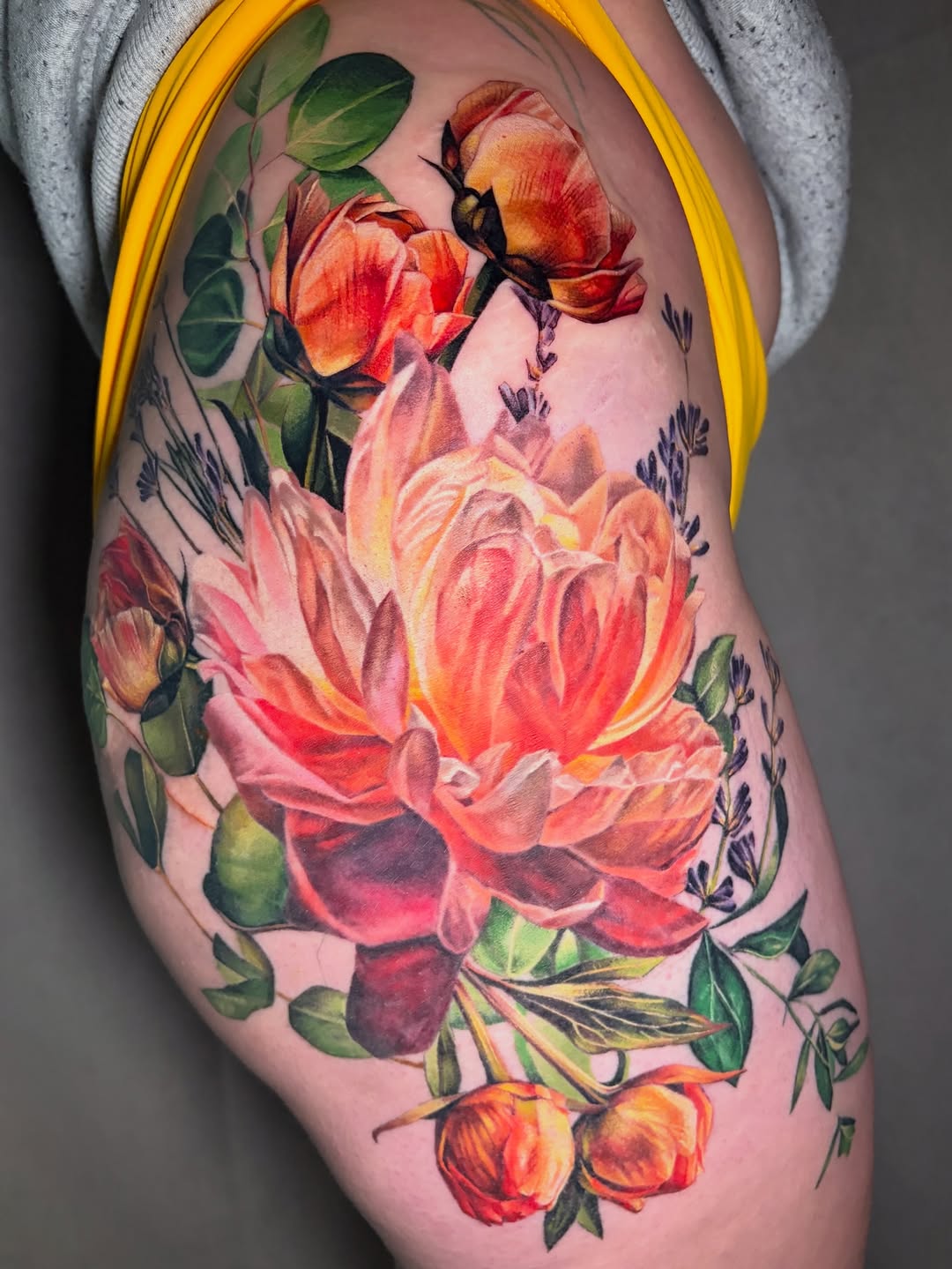Floral arrangement with roses and lavender neo-traditional tattoo on the thigh by Irina Shapiro, Somerville, Massachusetts