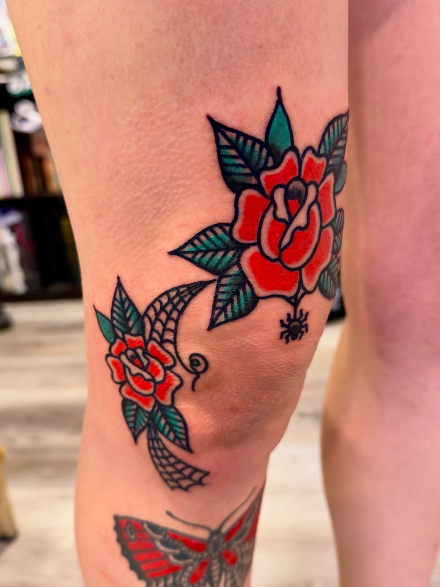 Rose and fish American traditional tattoo on the forearm by Jimmy Kelley