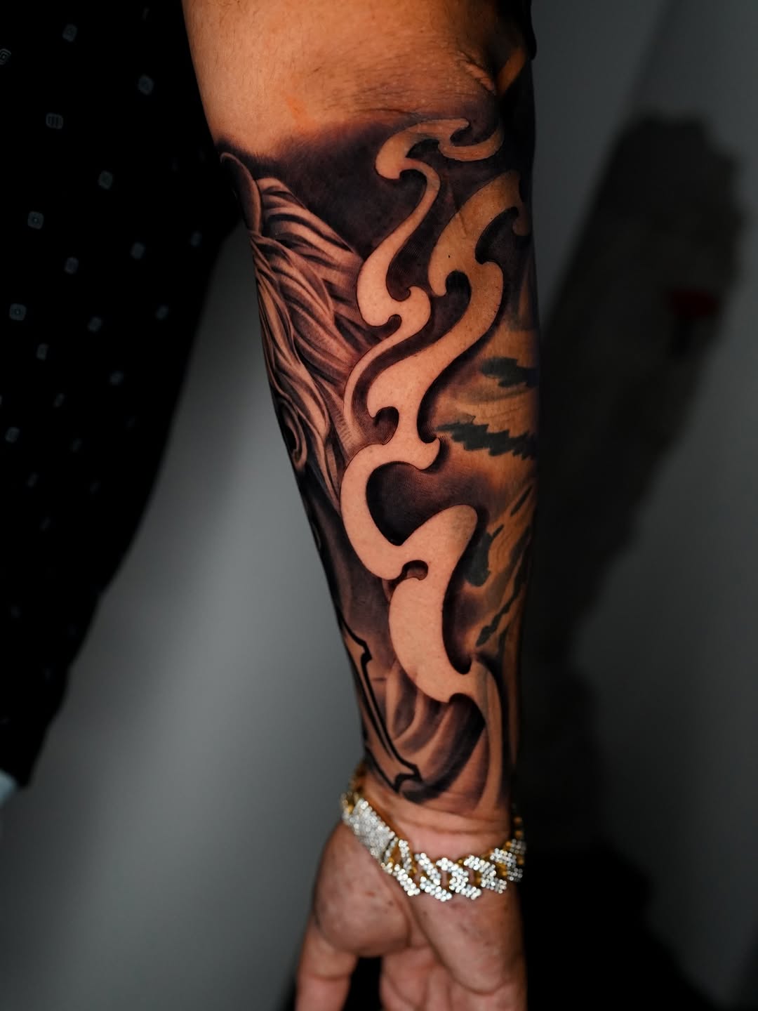 Abstract smoke and dragon Japanese tattoo on the forearm by Salvador Saenz Jr, Dallas, Texas