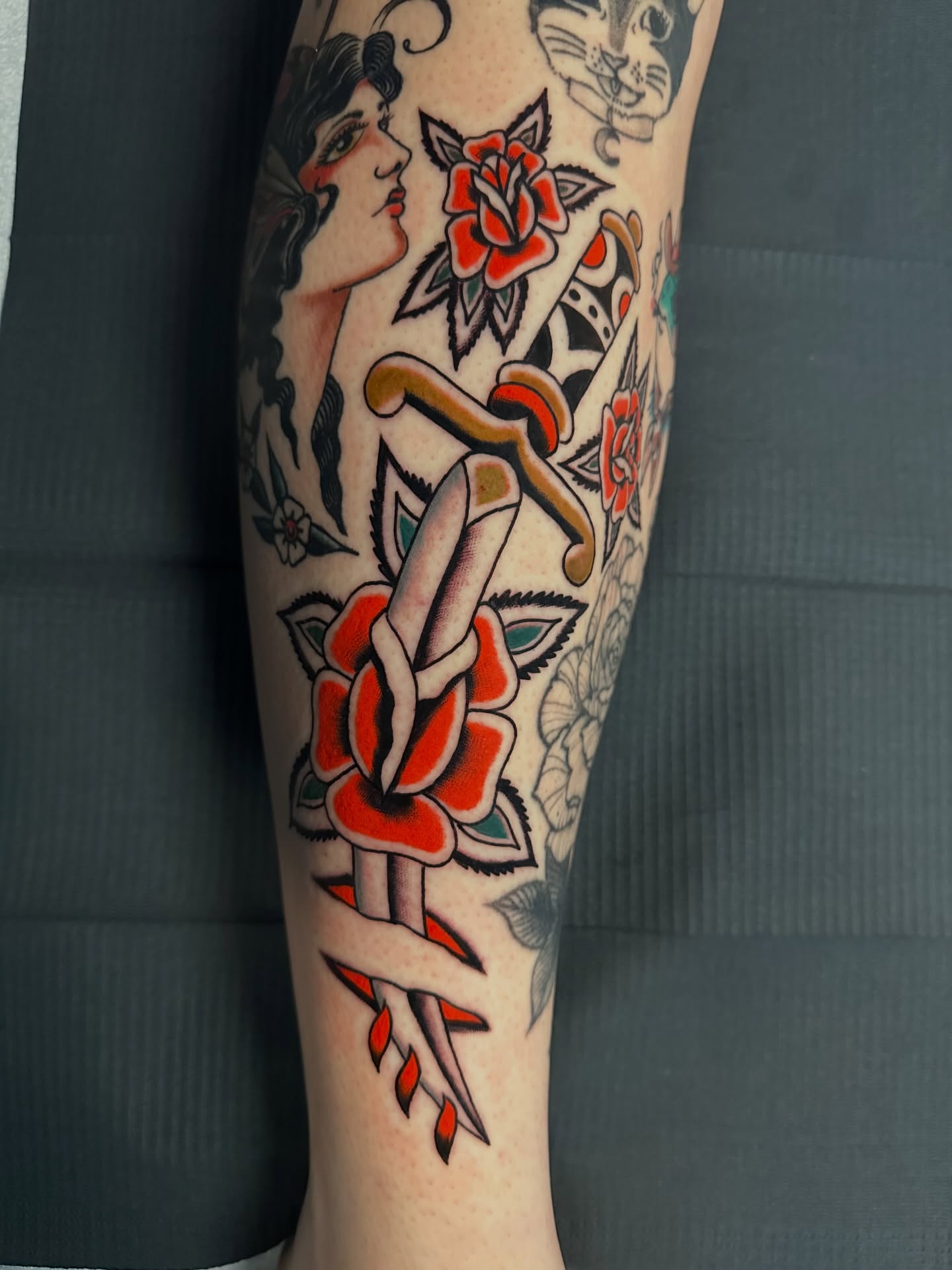 Rose and dagger American traditional tattoo on the forearm by A.j. Lingerfeldt, Nashville, Tennessee