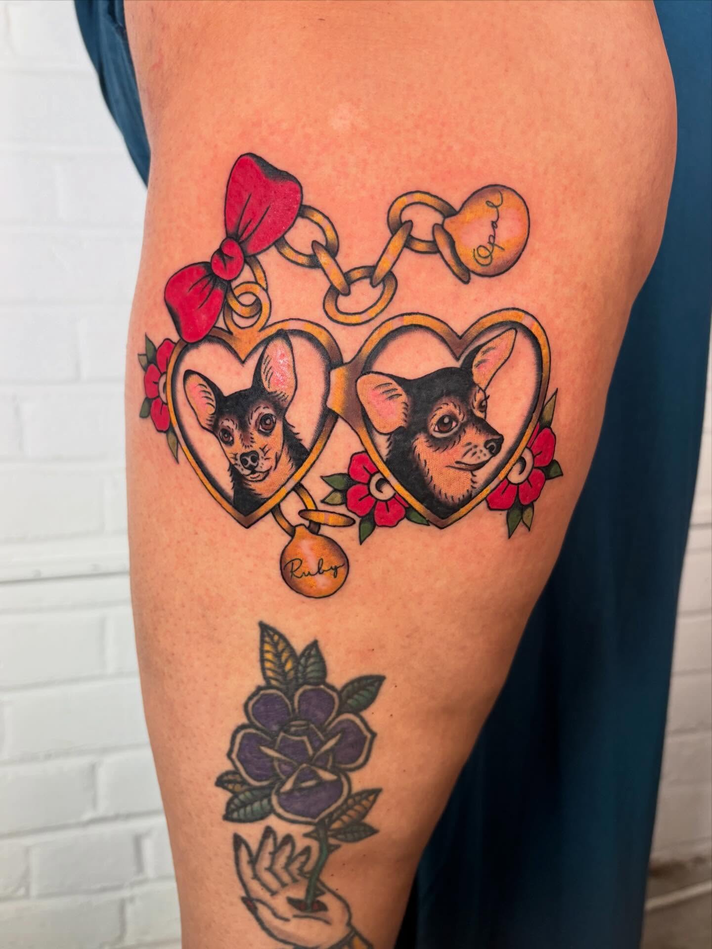 Chihuahuas in hearts American traditional tattoo on the thigh by Lorelei