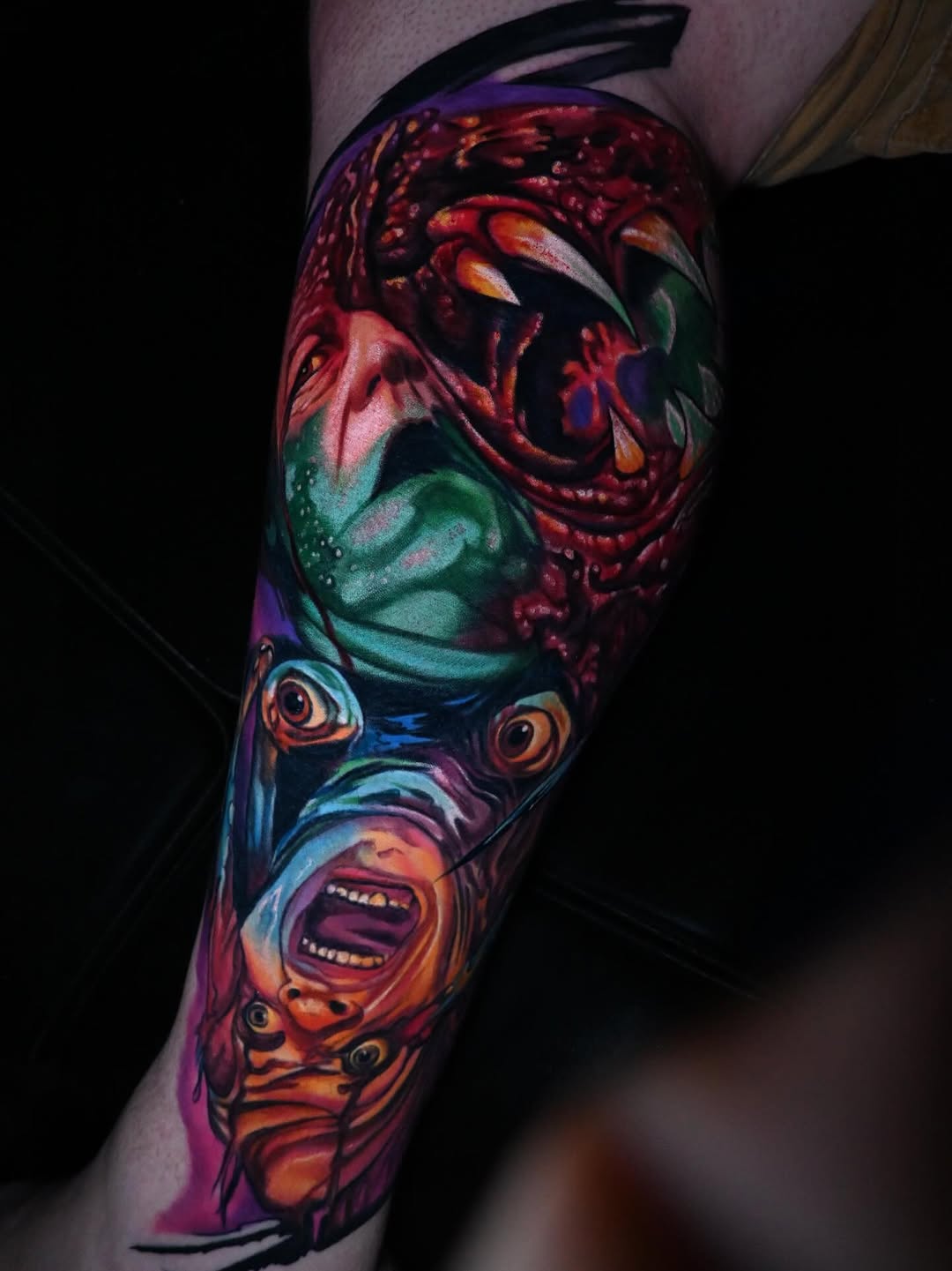 Monsters and screaming faces surrealism tattoo on the forearm by William Pollock