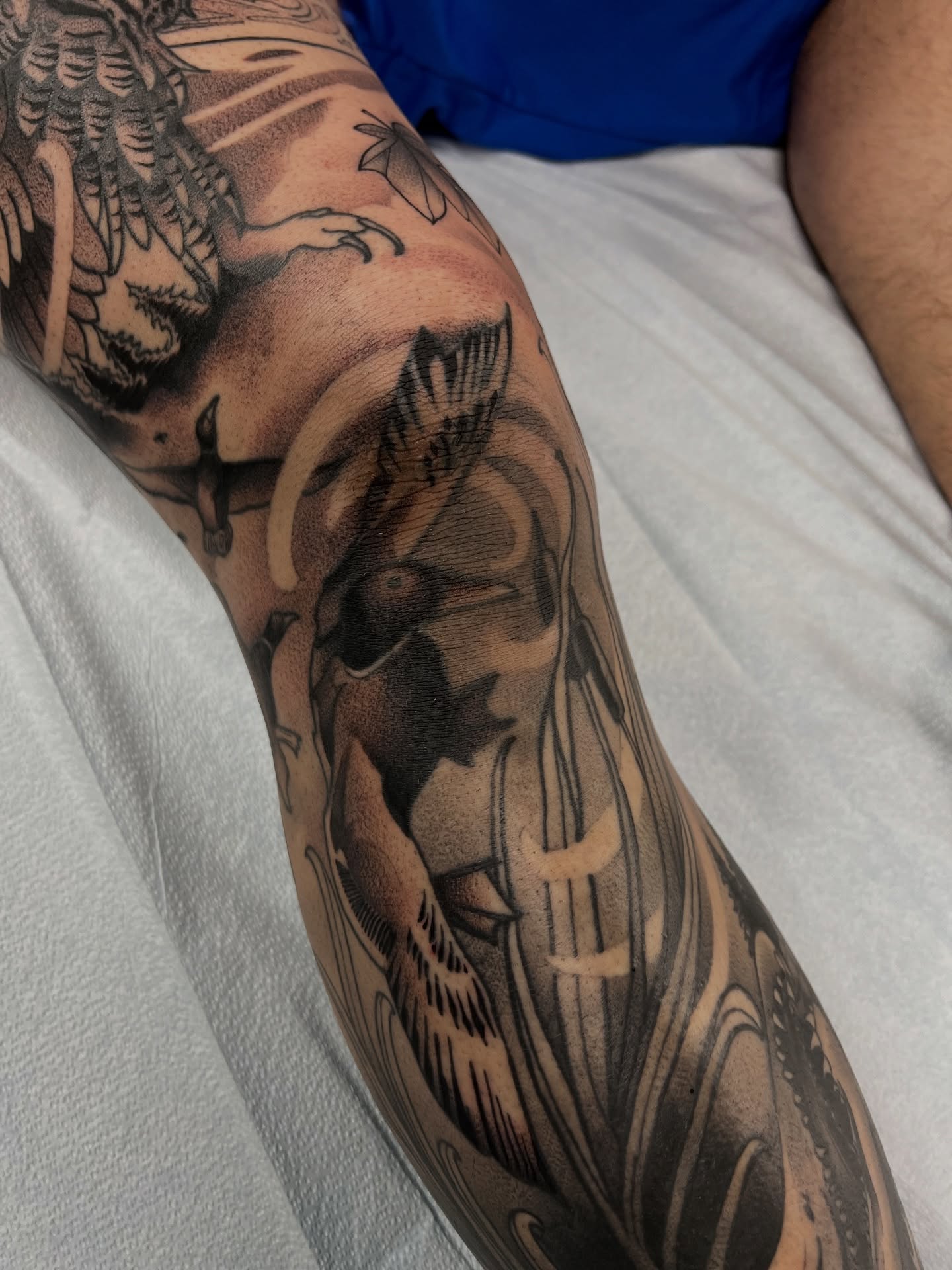 Ducks and waves black and grey tattoo on the forearm by Nathan Garcia