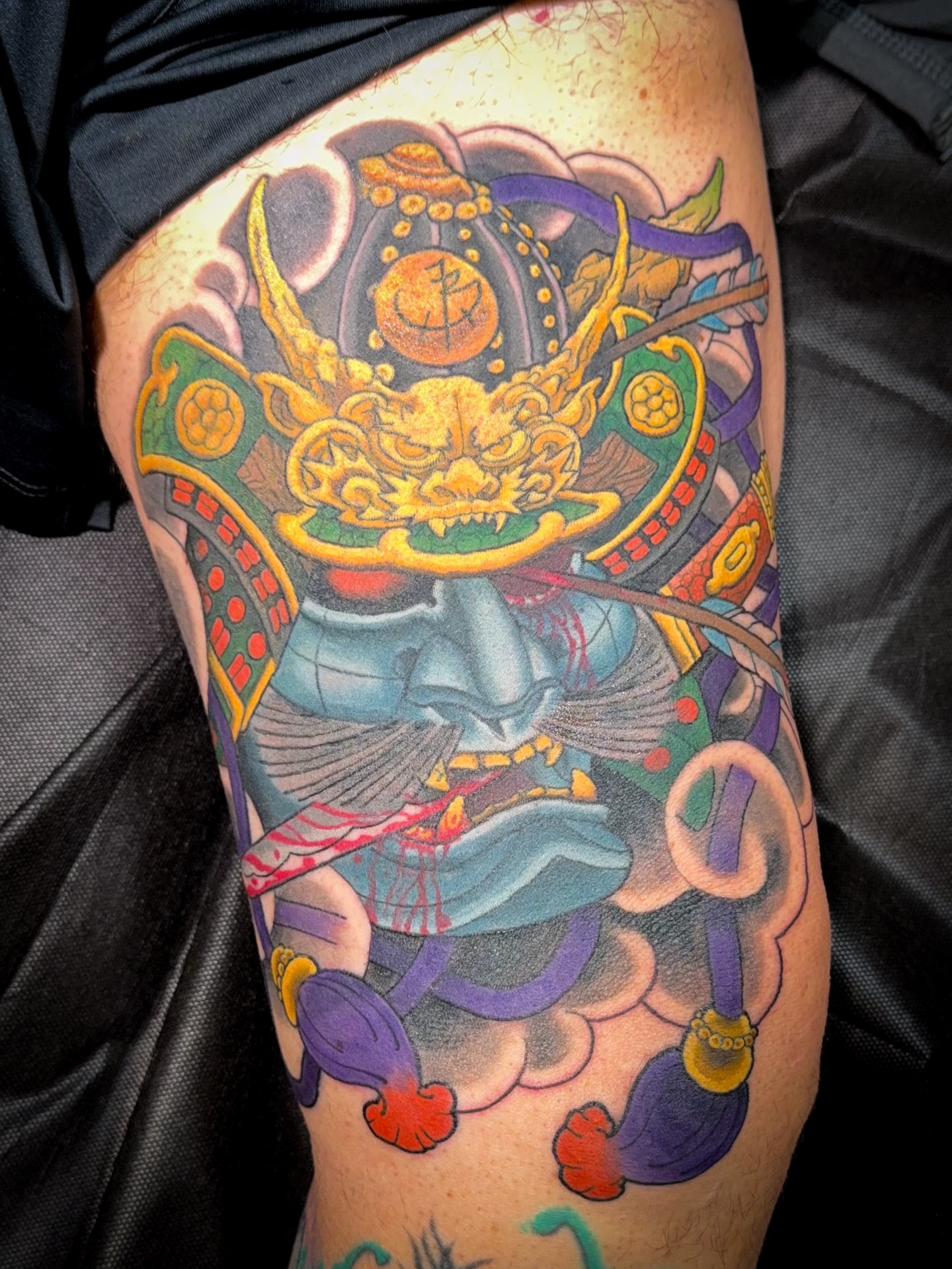 Samurai helmet japanese irezumi tattoo on the thigh by James Bird, Vancouver, British Columbia