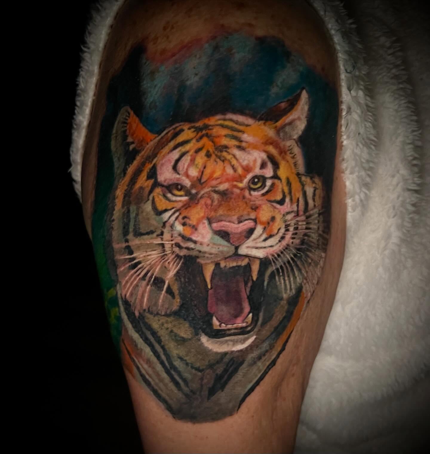 Tiger realism tattoo on the forearm by James Richardson