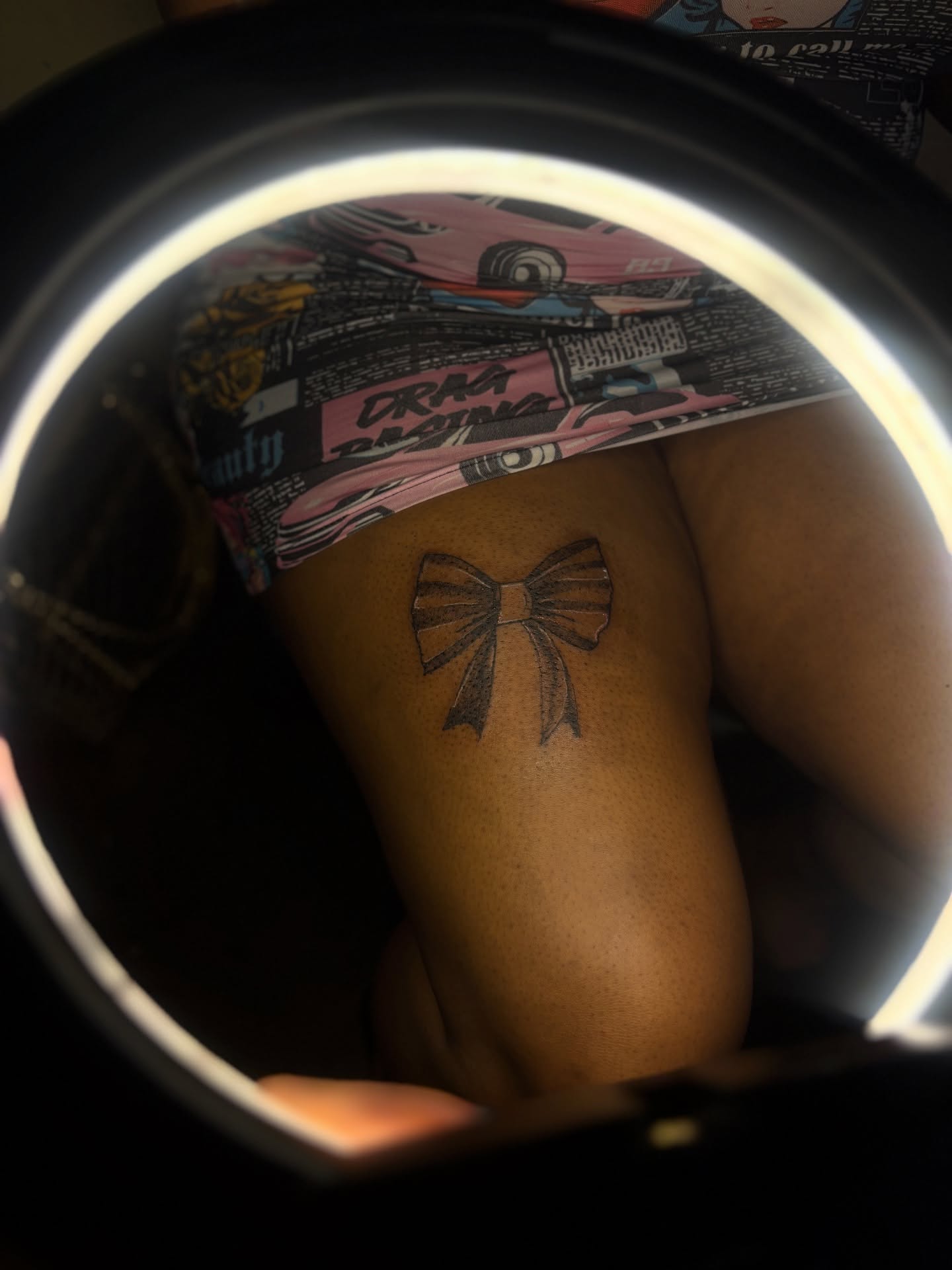Bow black and grey tattoo on the thigh by Winter j