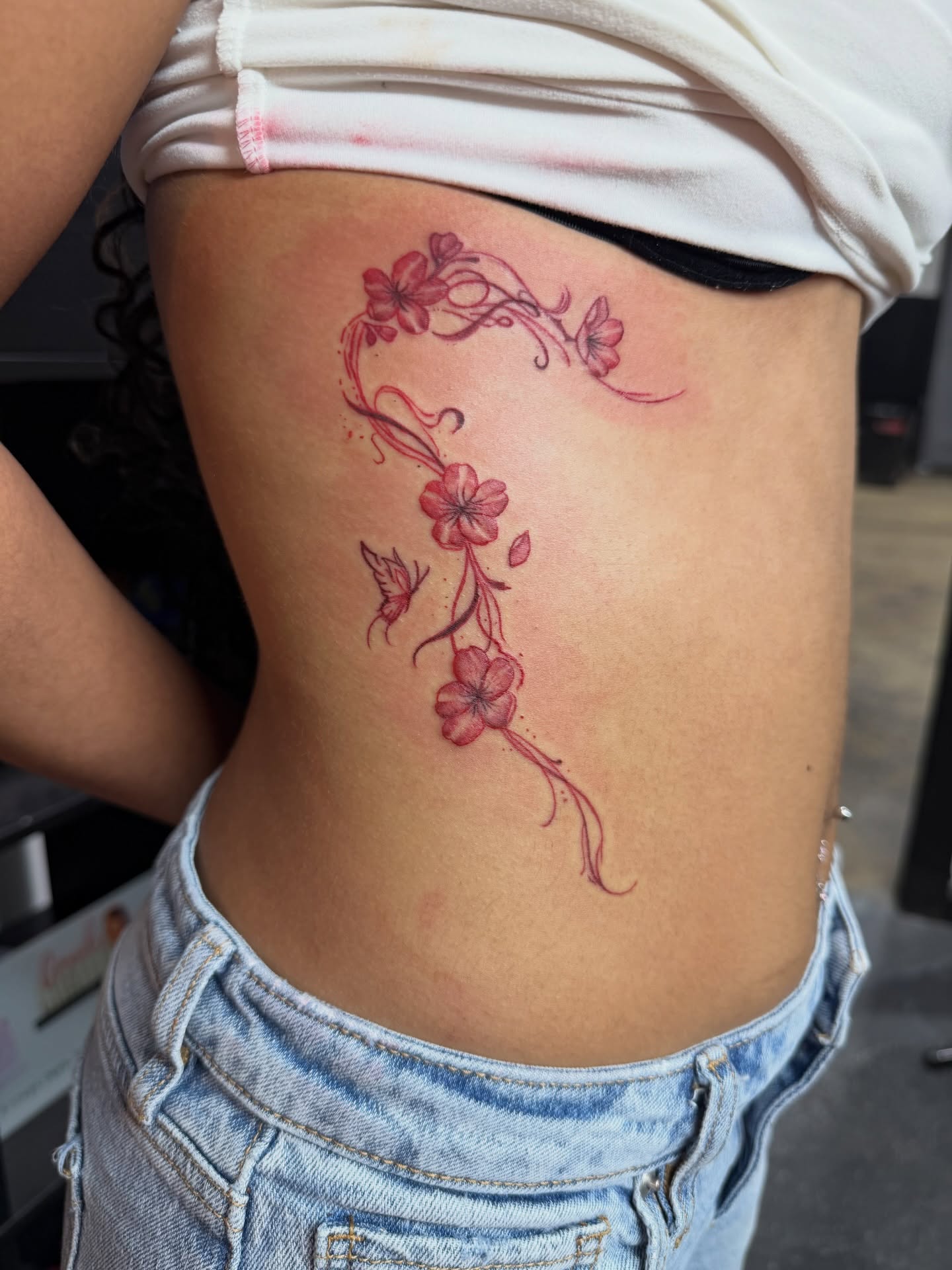 Cherry blossoms dotwork tattoo on the ribs by CandiCoatedInk