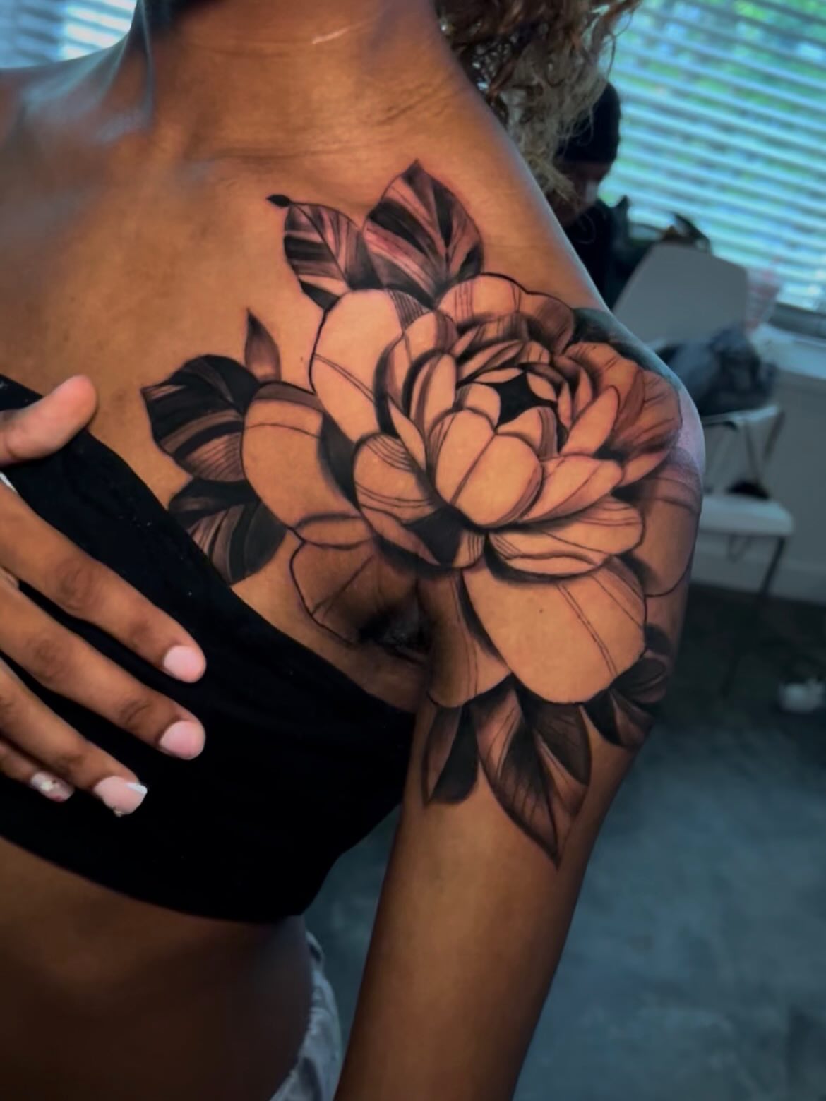 Flower black and grey tattoo on the shoulder by Lucky Lefty