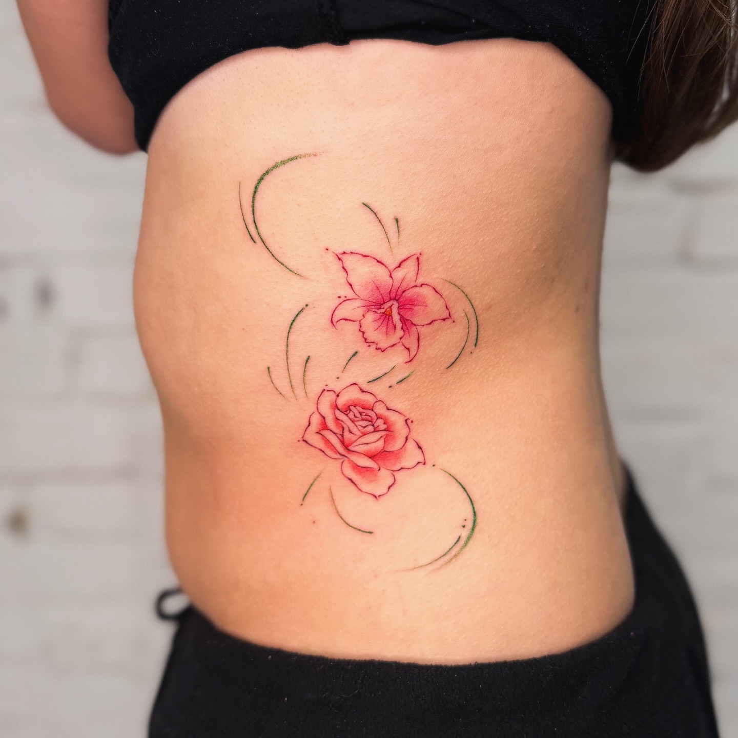 Floral arrangement new school tattoo on the ribs by justin