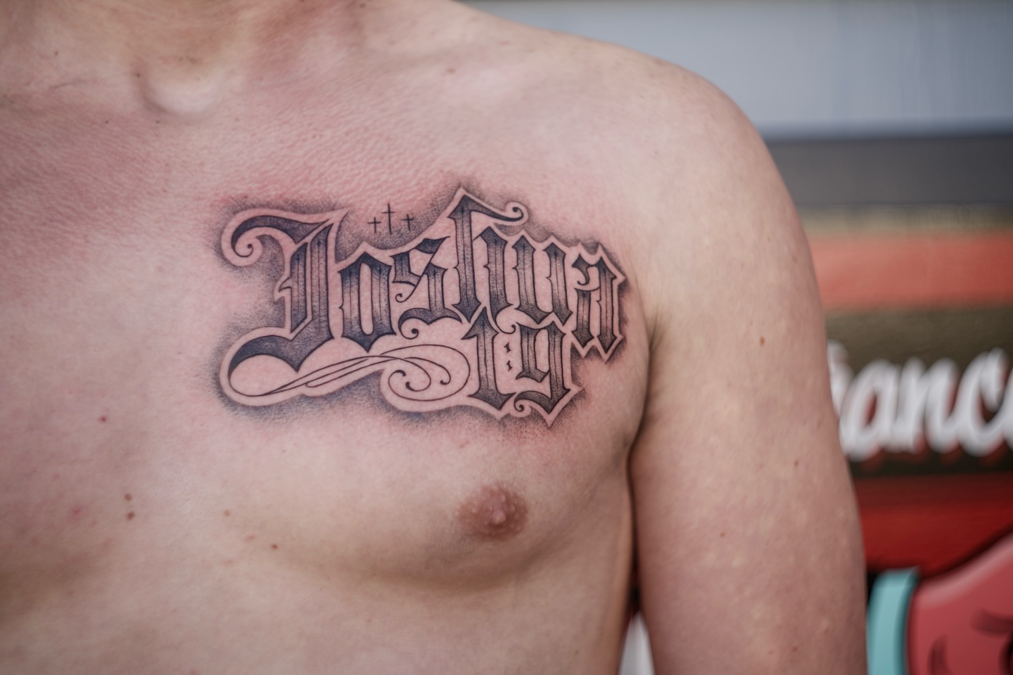 Gothic script lettering script tattoo on the chest by Kevin Rotramel, Dayton, Ohio