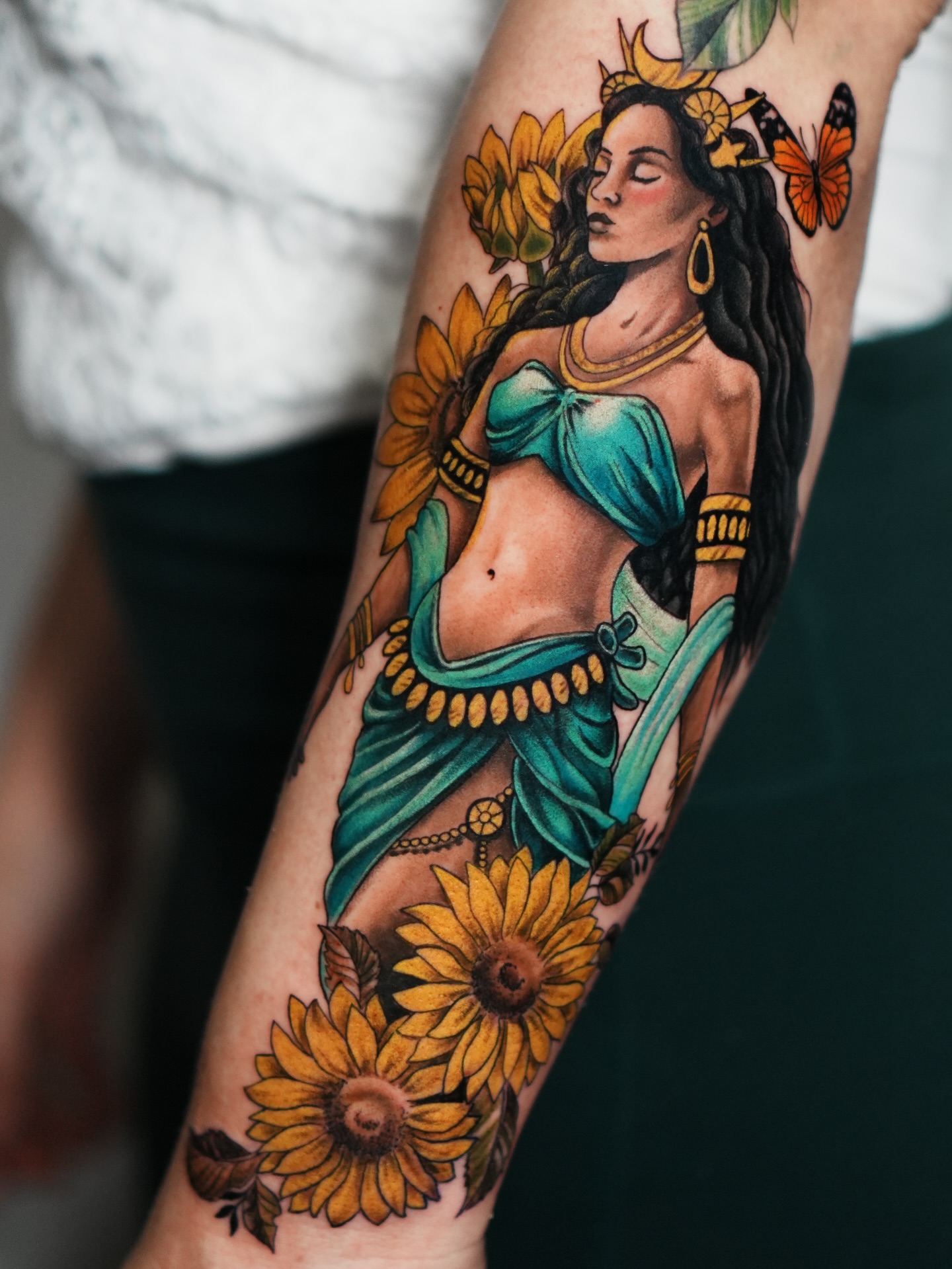 Belly dancer with sunflowers American traditional tattoo on the forearm by Drex - Dallas Tattoo Artist