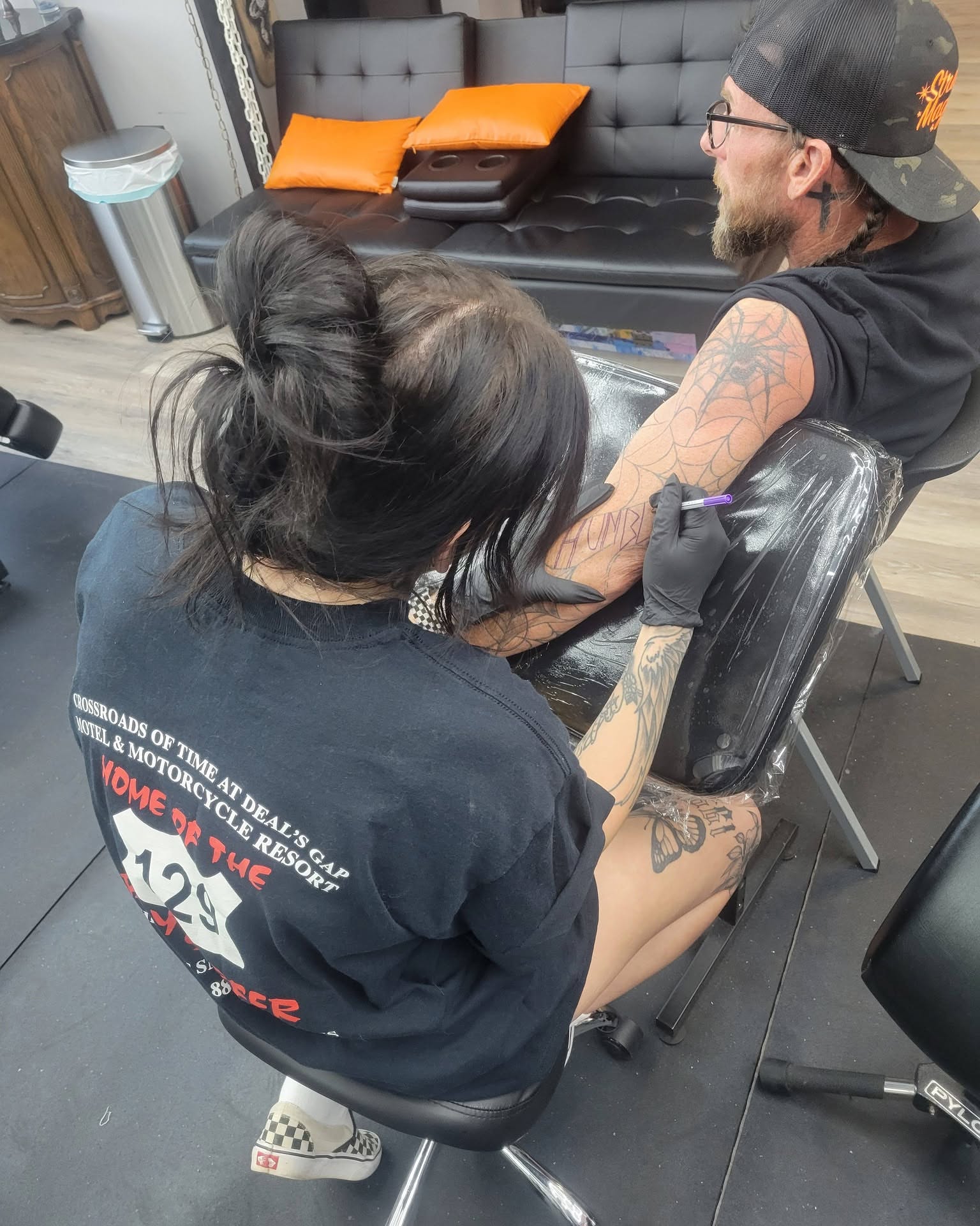 Spider black and grey tattoo on the upper arm by Danny Stewart