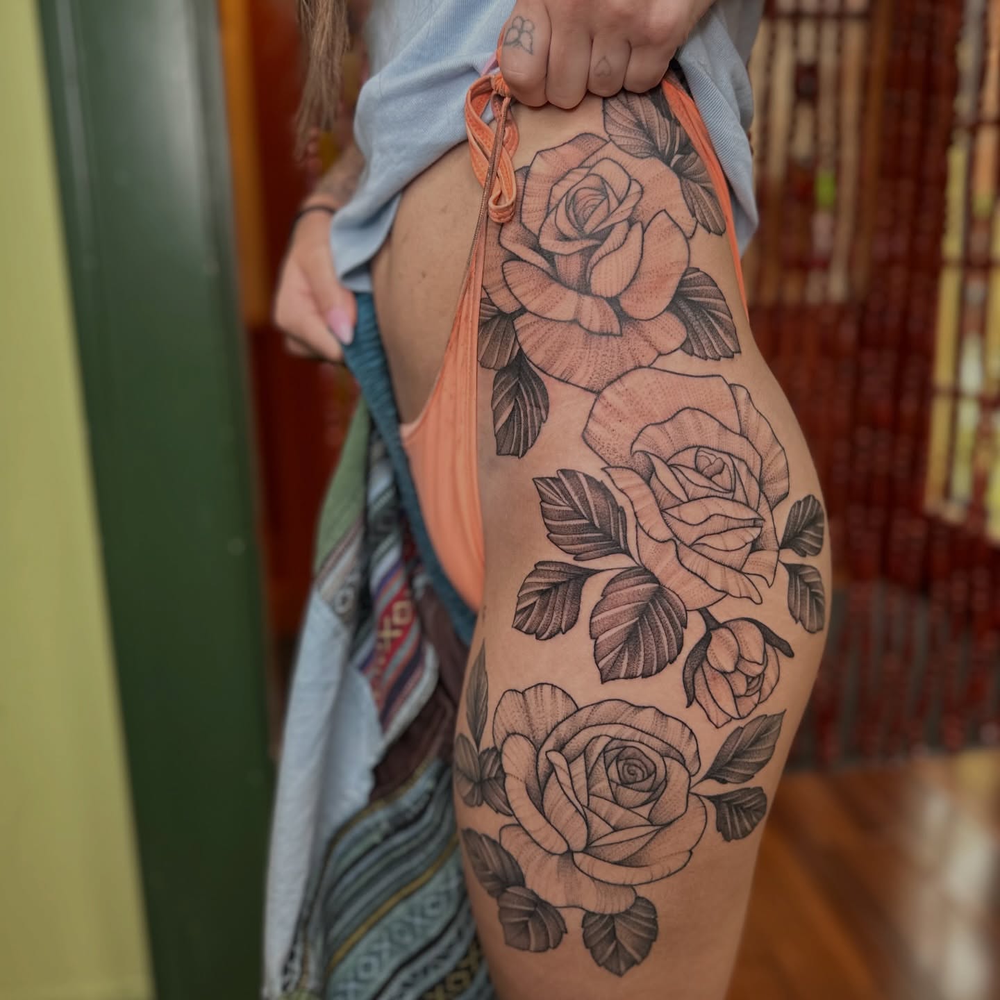 Roses black and grey tattoo on the thigh by Brieana Smith