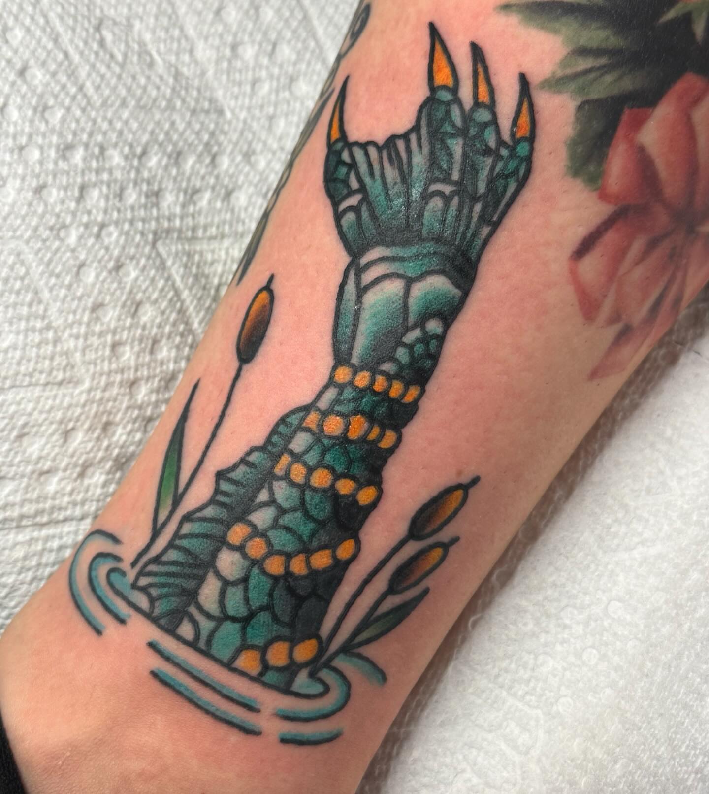 Alligator tail American traditional tattoo on the forearm by lindsay