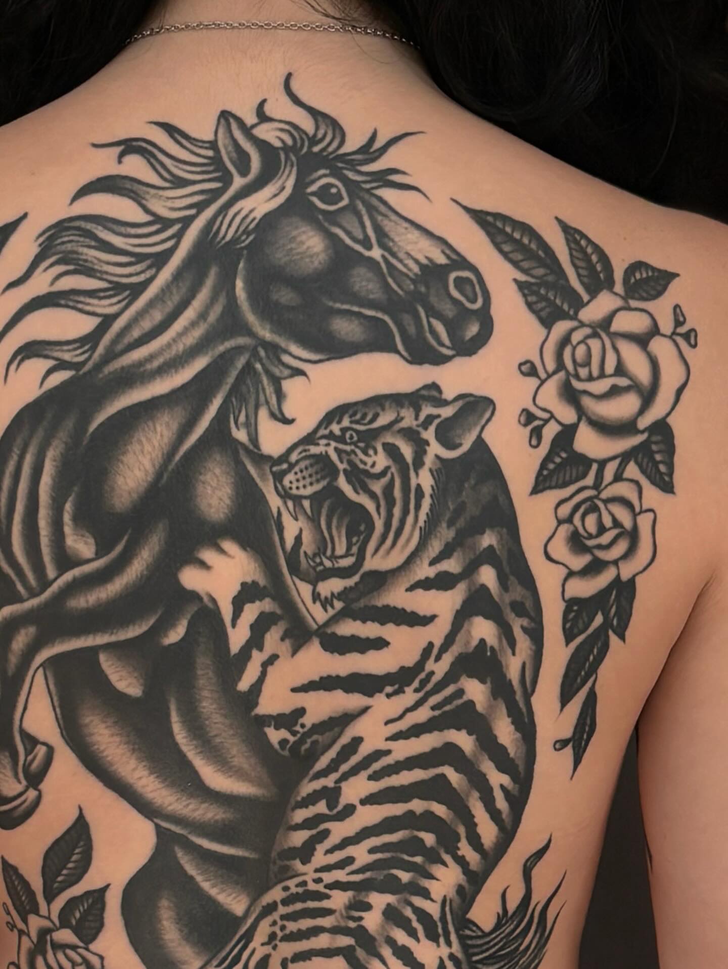 Horse and tiger American traditional tattoo on the back by Jesse Smith, Chicago, Illinois