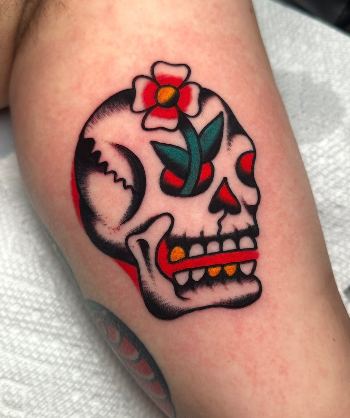 Sugar skull American traditional tattoo on the forearm by Zahra Niedermann
