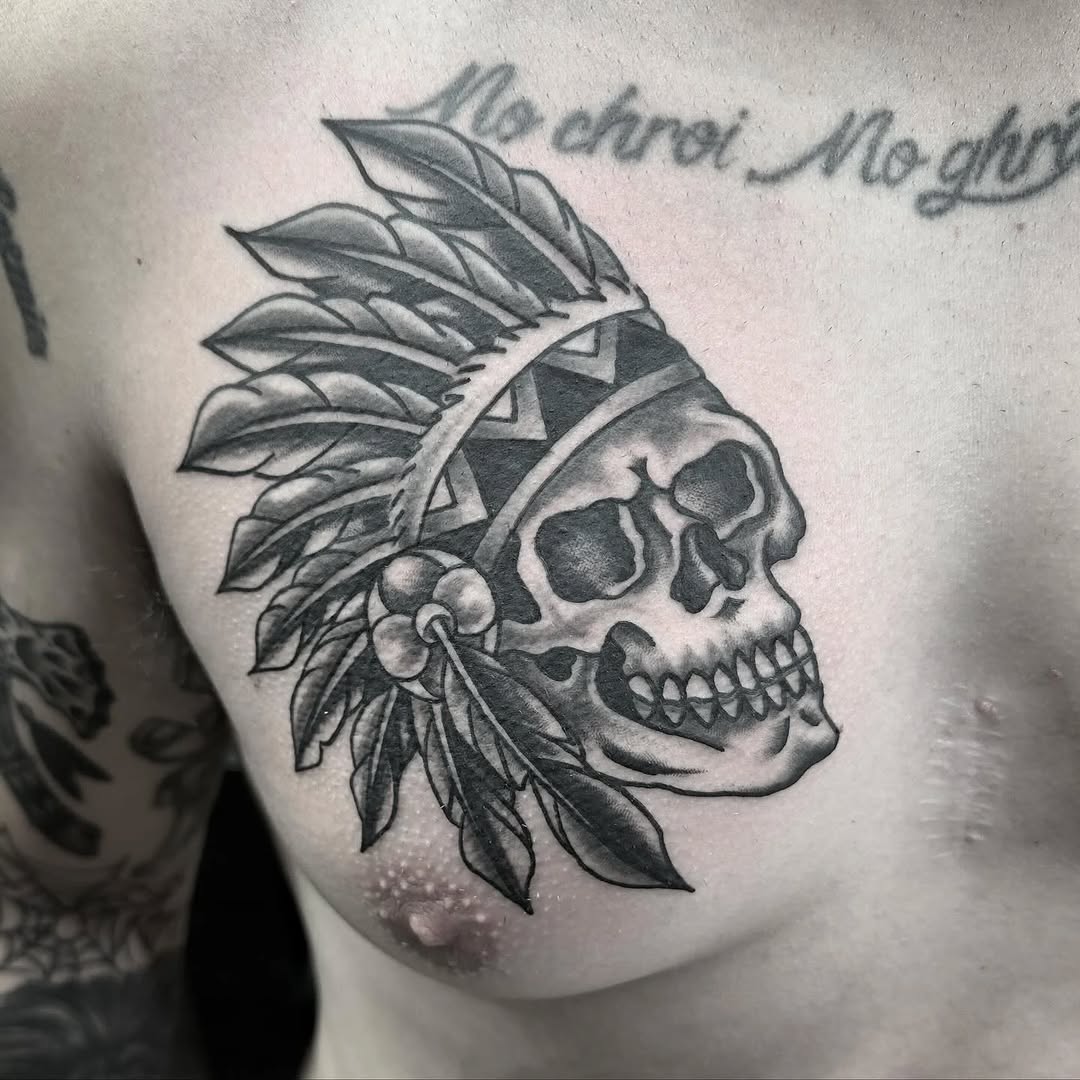 Skull with headdress realism tattoo on the shoulder by Greyson Heidenreich