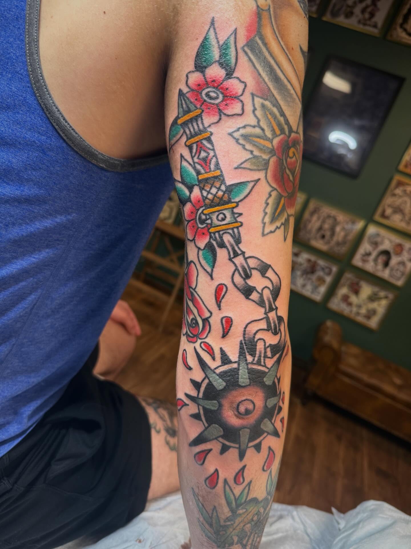Chain and flowers American traditional tattoo on the forearm by Ryan Moraski, Colorado Springs, Colorado