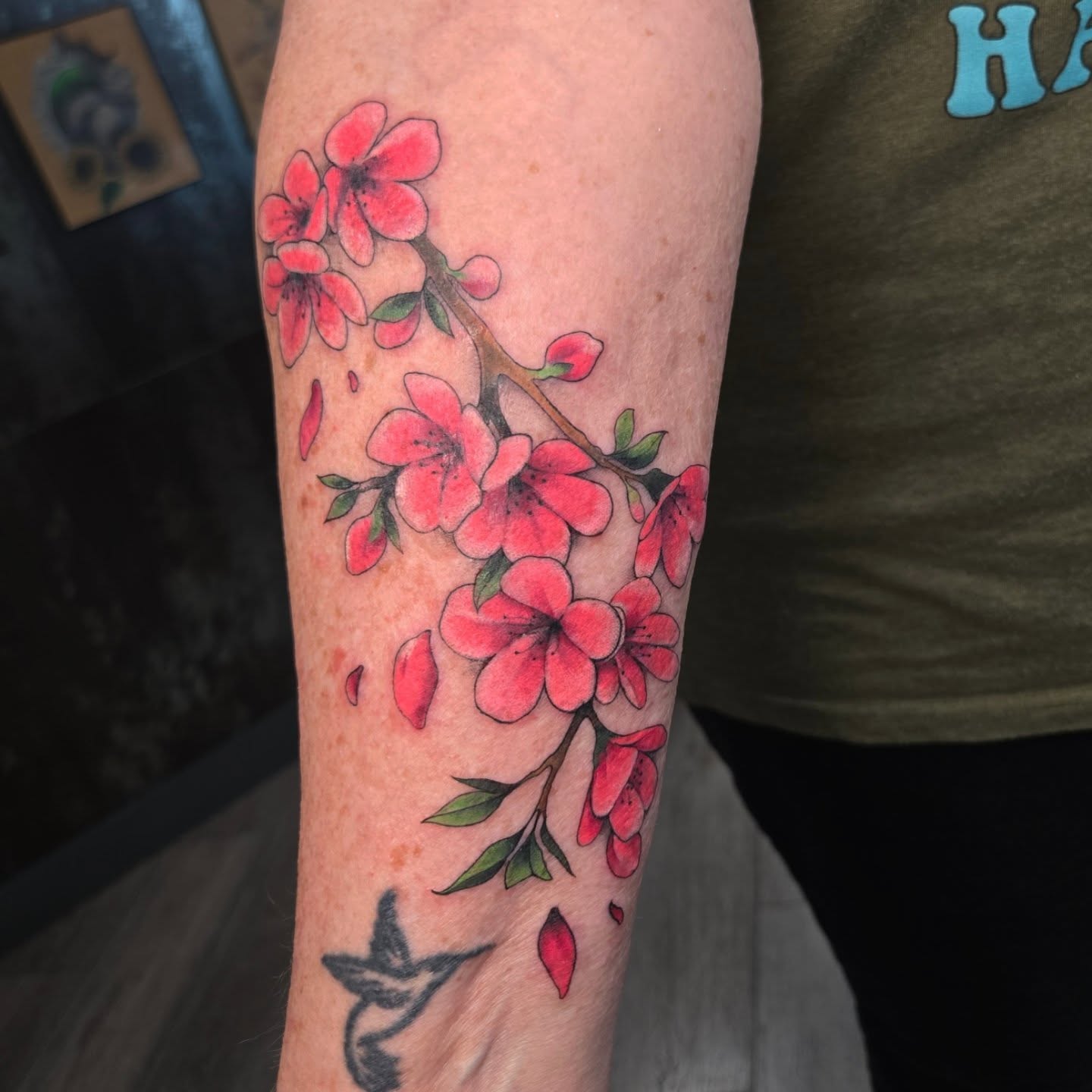 Cherry blossoms watercolor tattoo on the forearm by Britty Love, Nashville, Tennessee