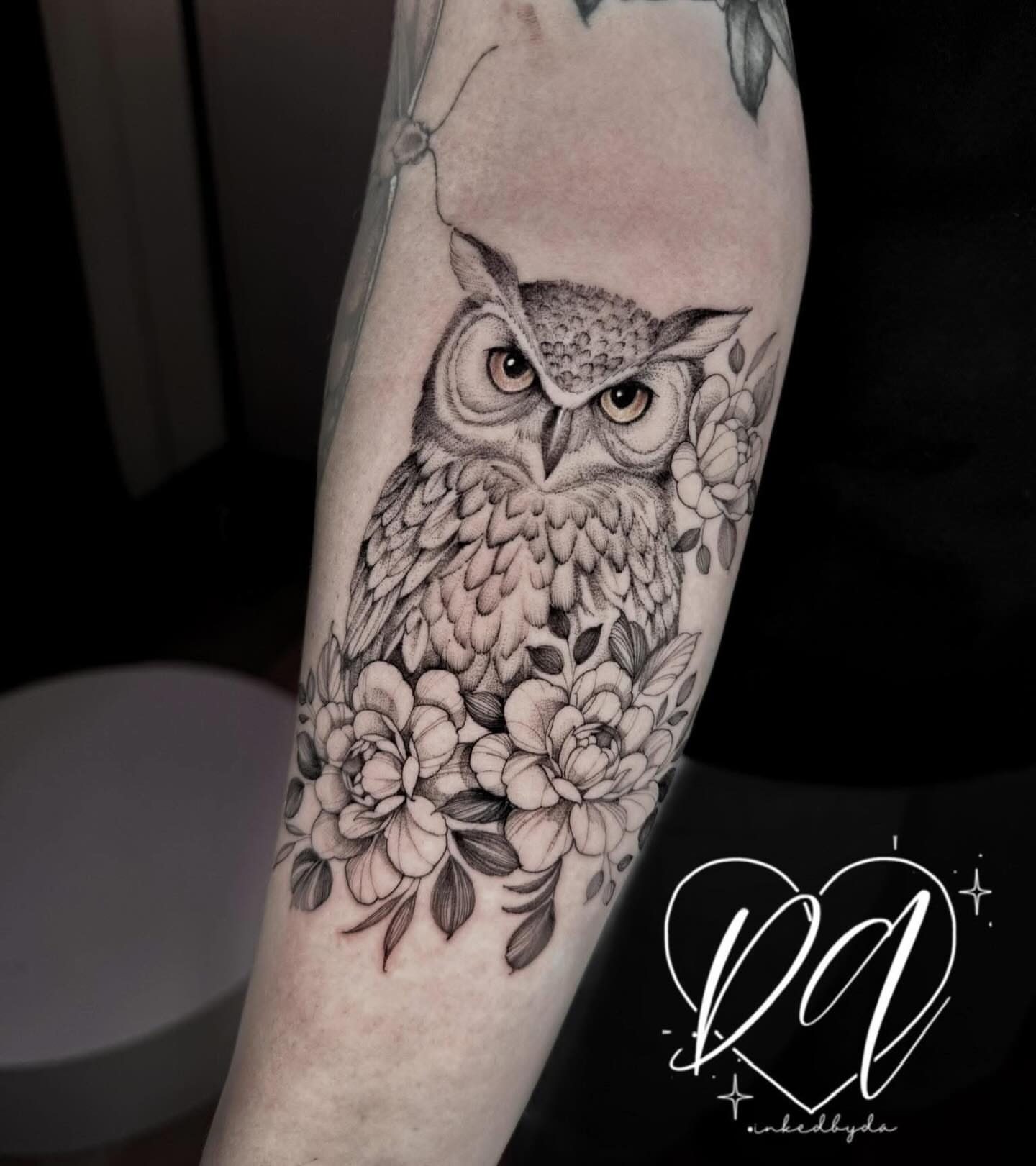 Owl and flowers realism tattoo on the forearm by Dalton Alexandria