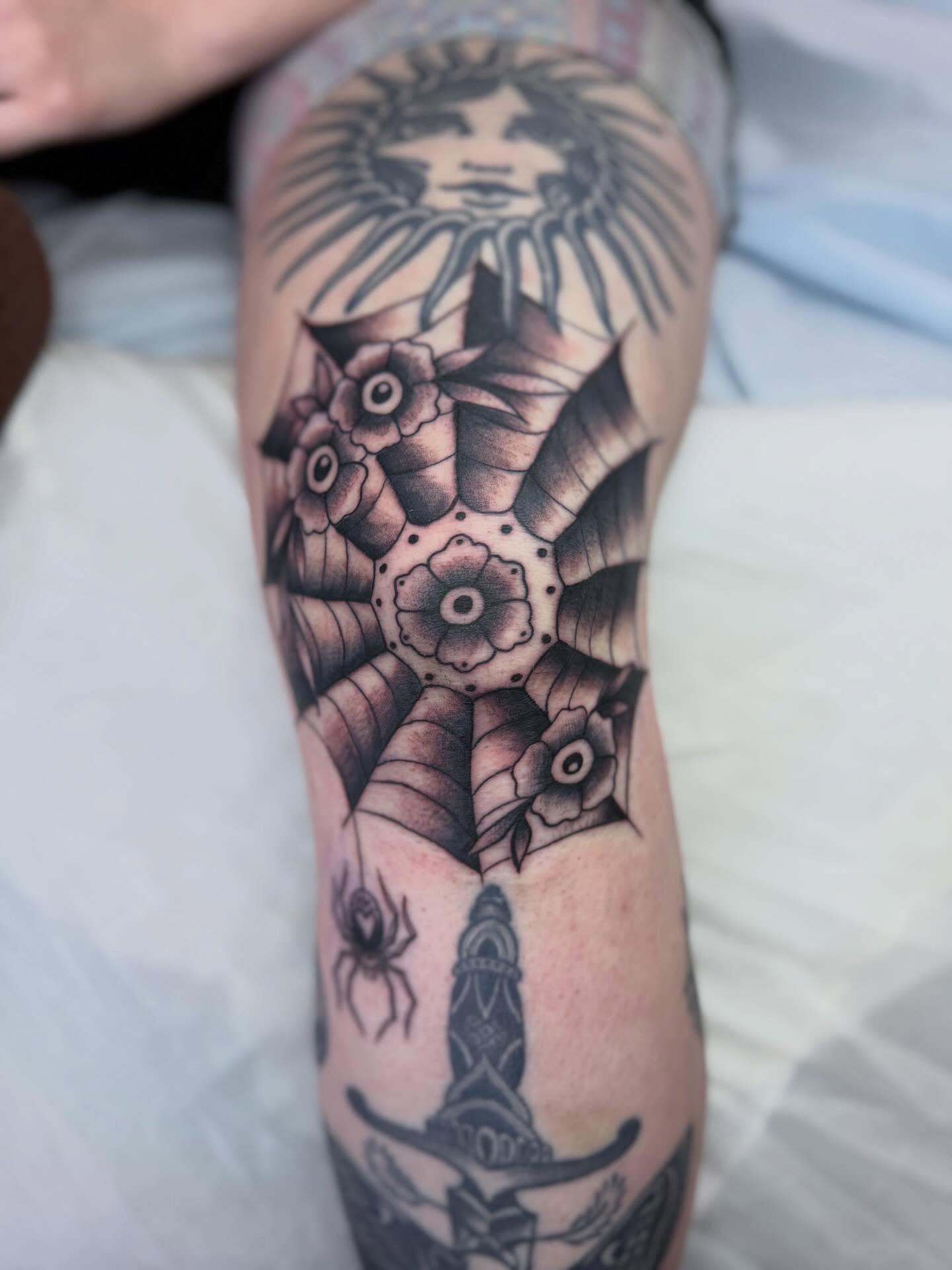 Geometric floral pattern geometric tattoo on the forearm by Sasha “Sashimi” Shabasov