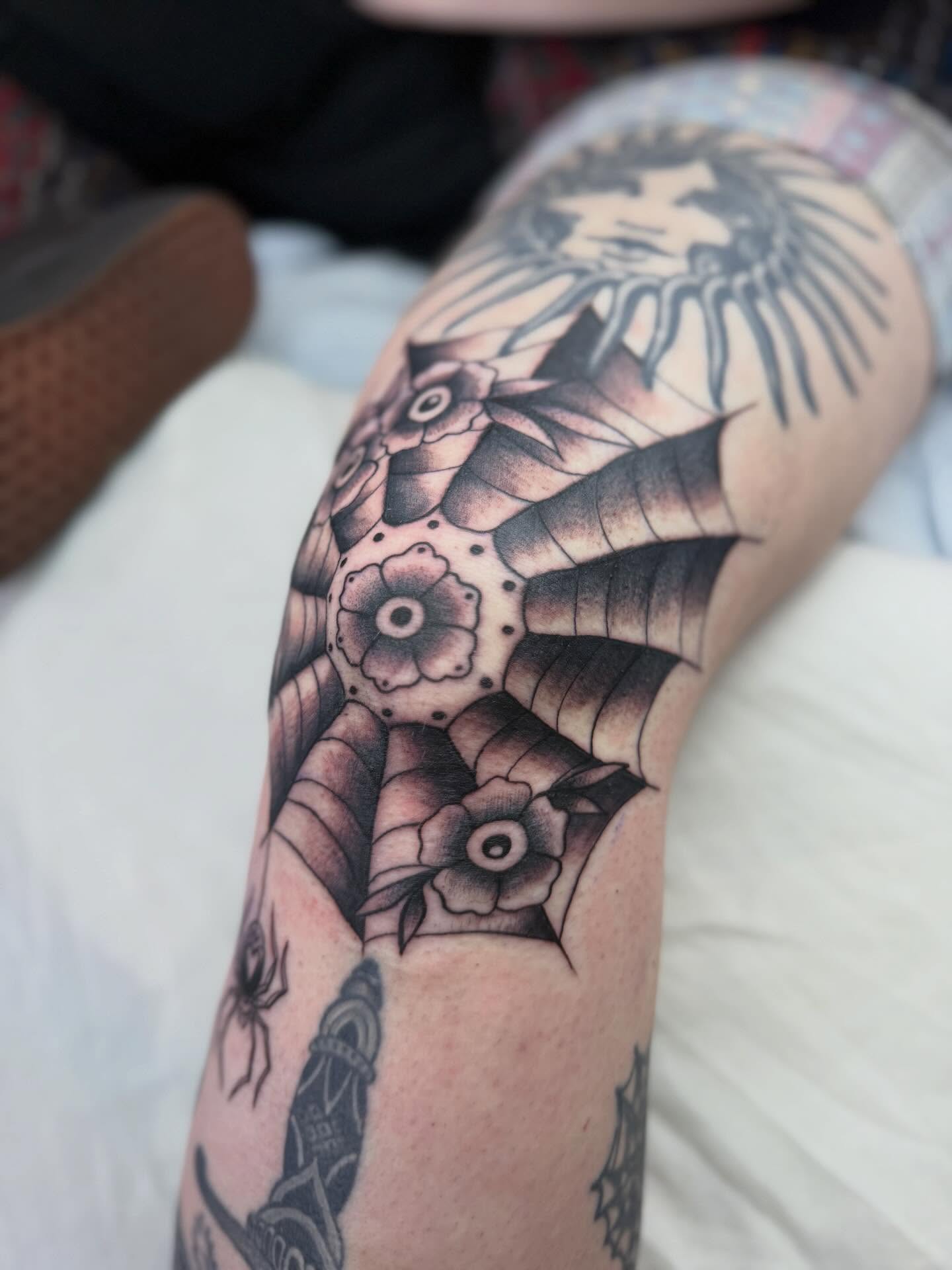 Geometric floral design geometric tattoo on the forearm by Sasha “Sashimi” Shabasov