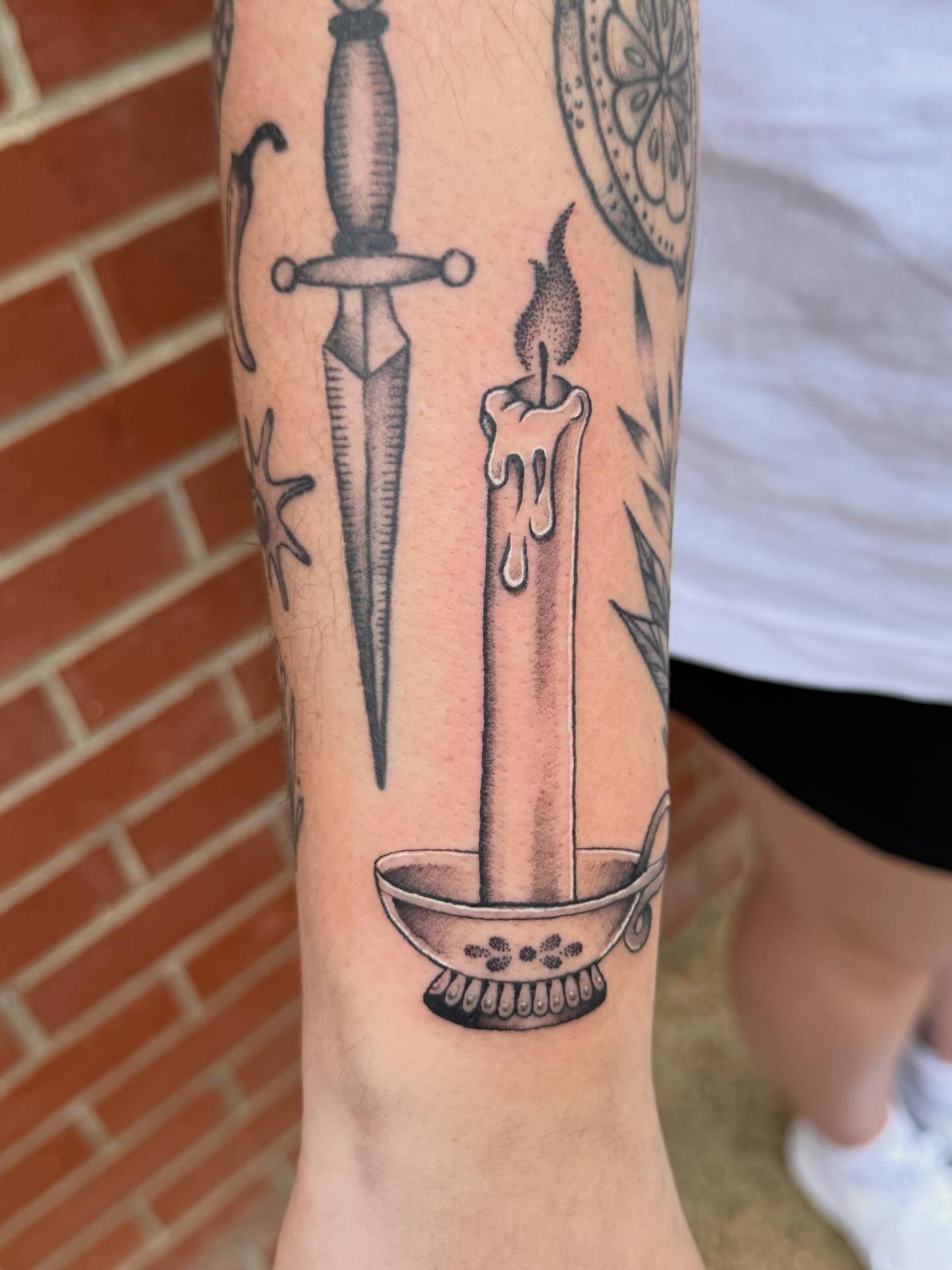 Candle and dagger black and grey tattoo on the forearm by Aly Rucker, Murfreesboro, Tennessee