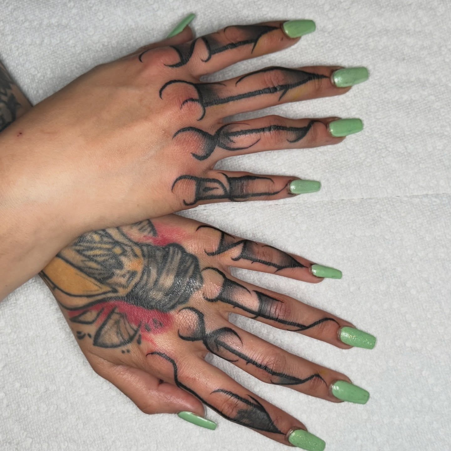 Hand with detailed tattoo American traditional tattoo on the hand by Casket