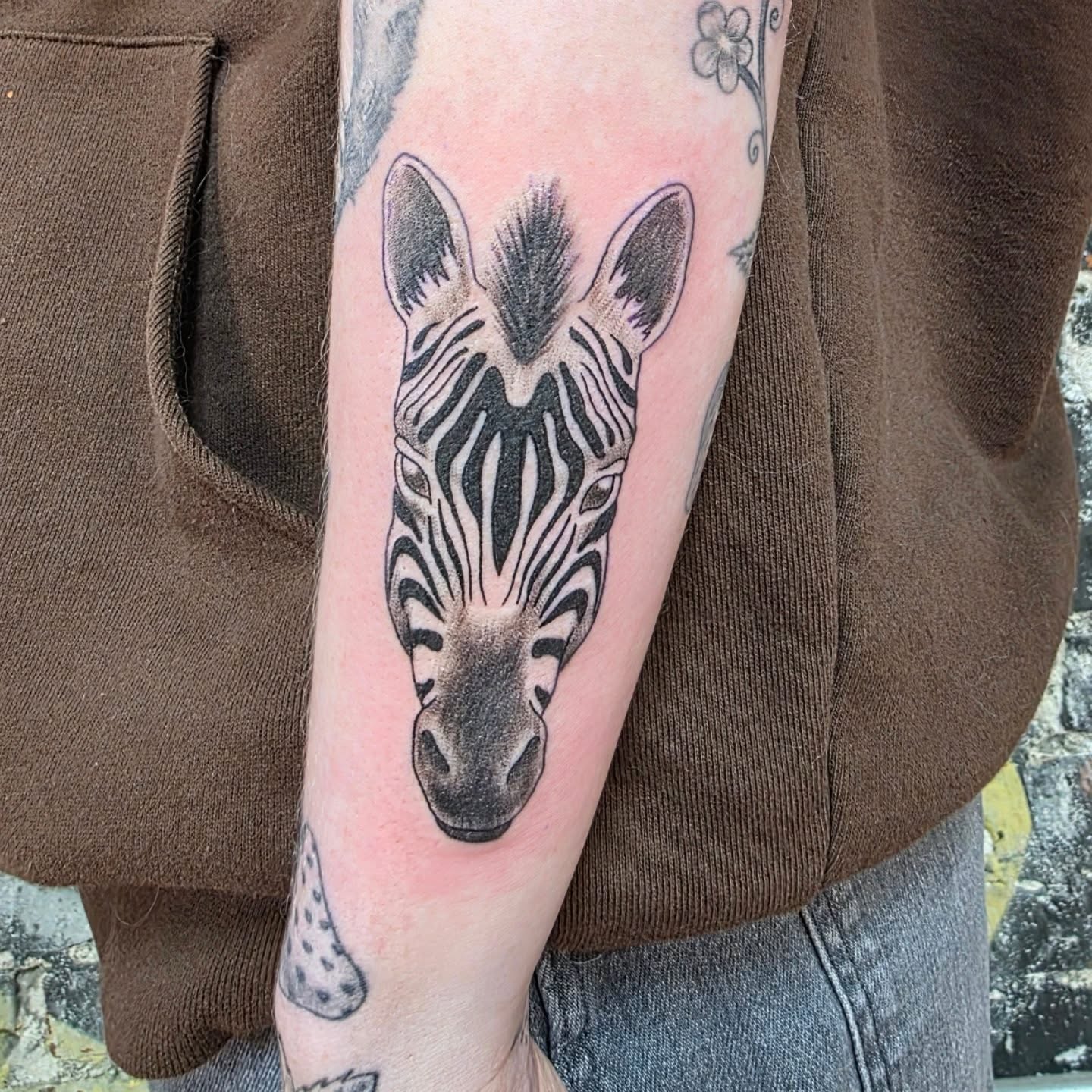 Zebra head realism tattoo on the forearm by Tattoos by Annie
