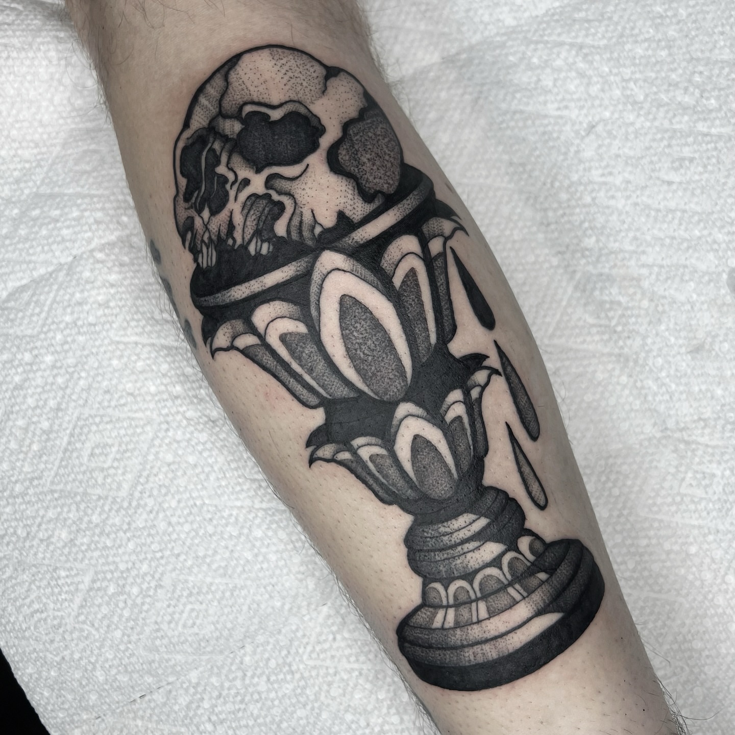 Skull and chess piece dotwork tattoo on the forearm by 𝑴𝑬𝑮𝑨𝑵 𝑪𝑳𝑰𝑭𝑻𝑶𝑵, Cincinnati, Ohio