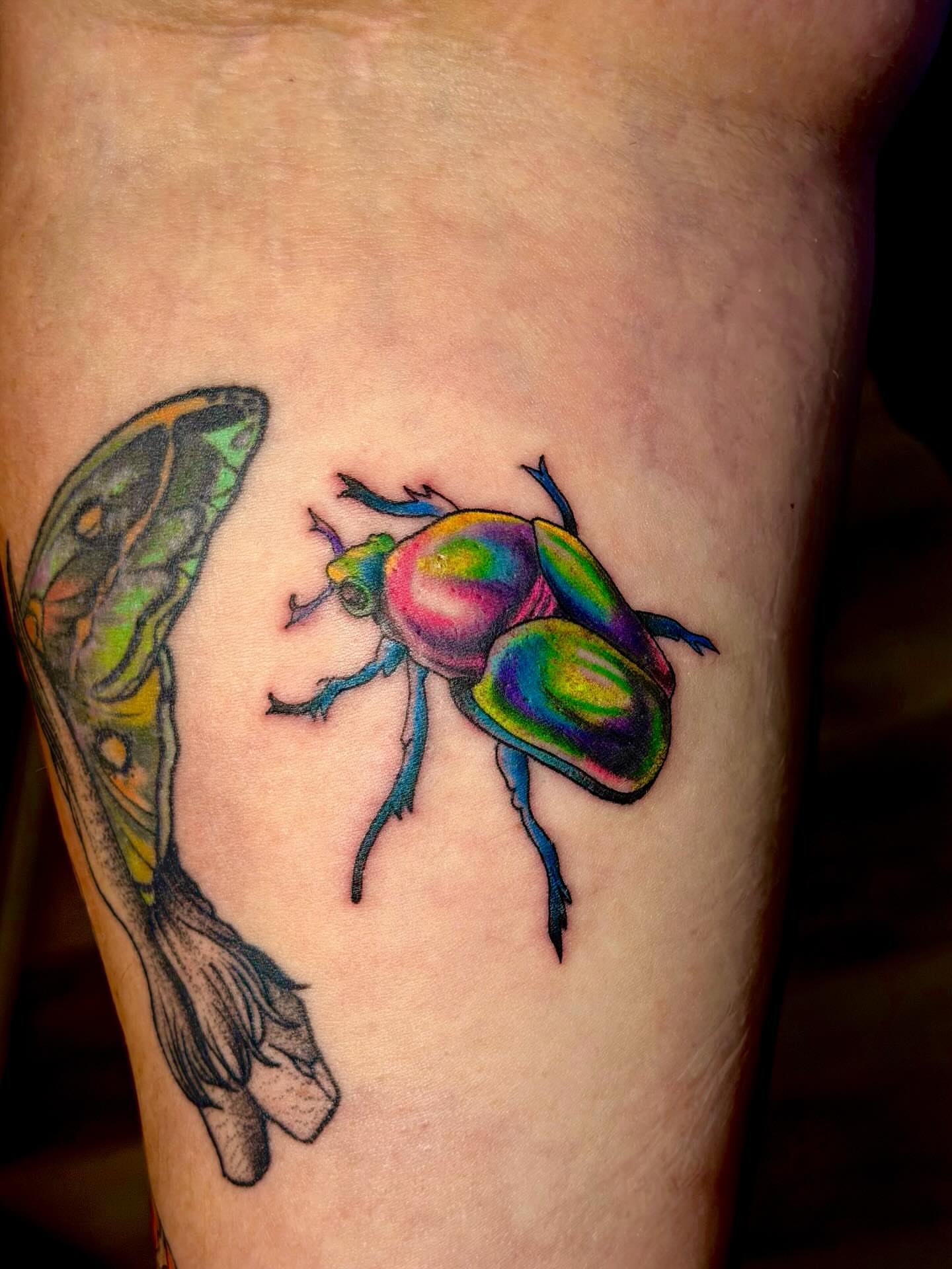 Beetle new school tattoo on the thigh by Emily