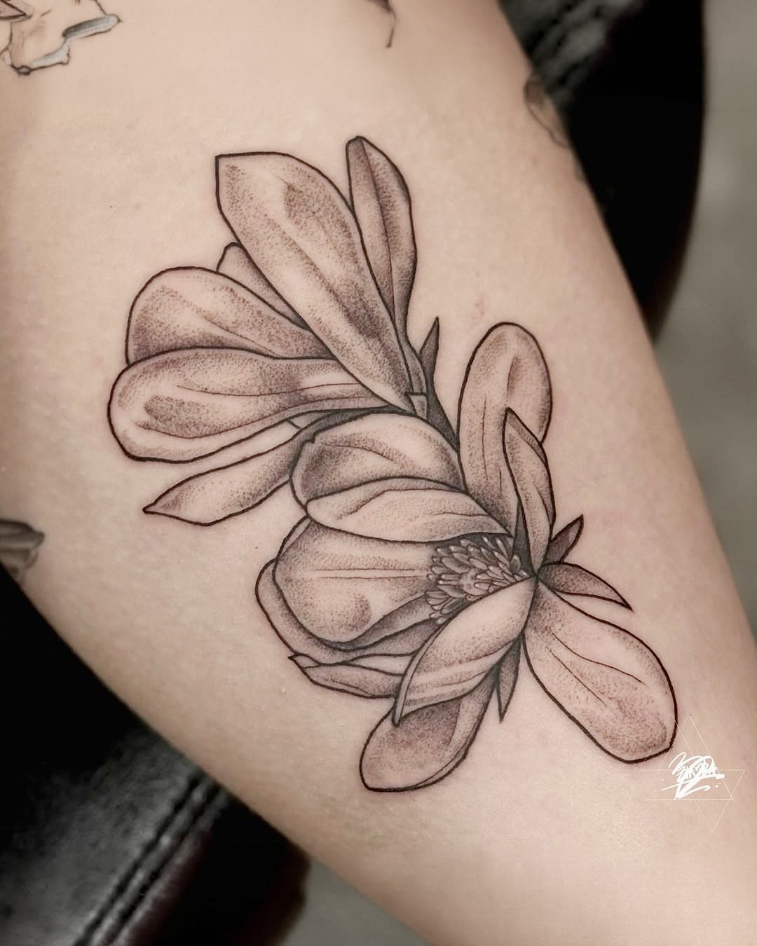 Magnolia flower dotwork tattoo on the forearm by Zhorana Devi